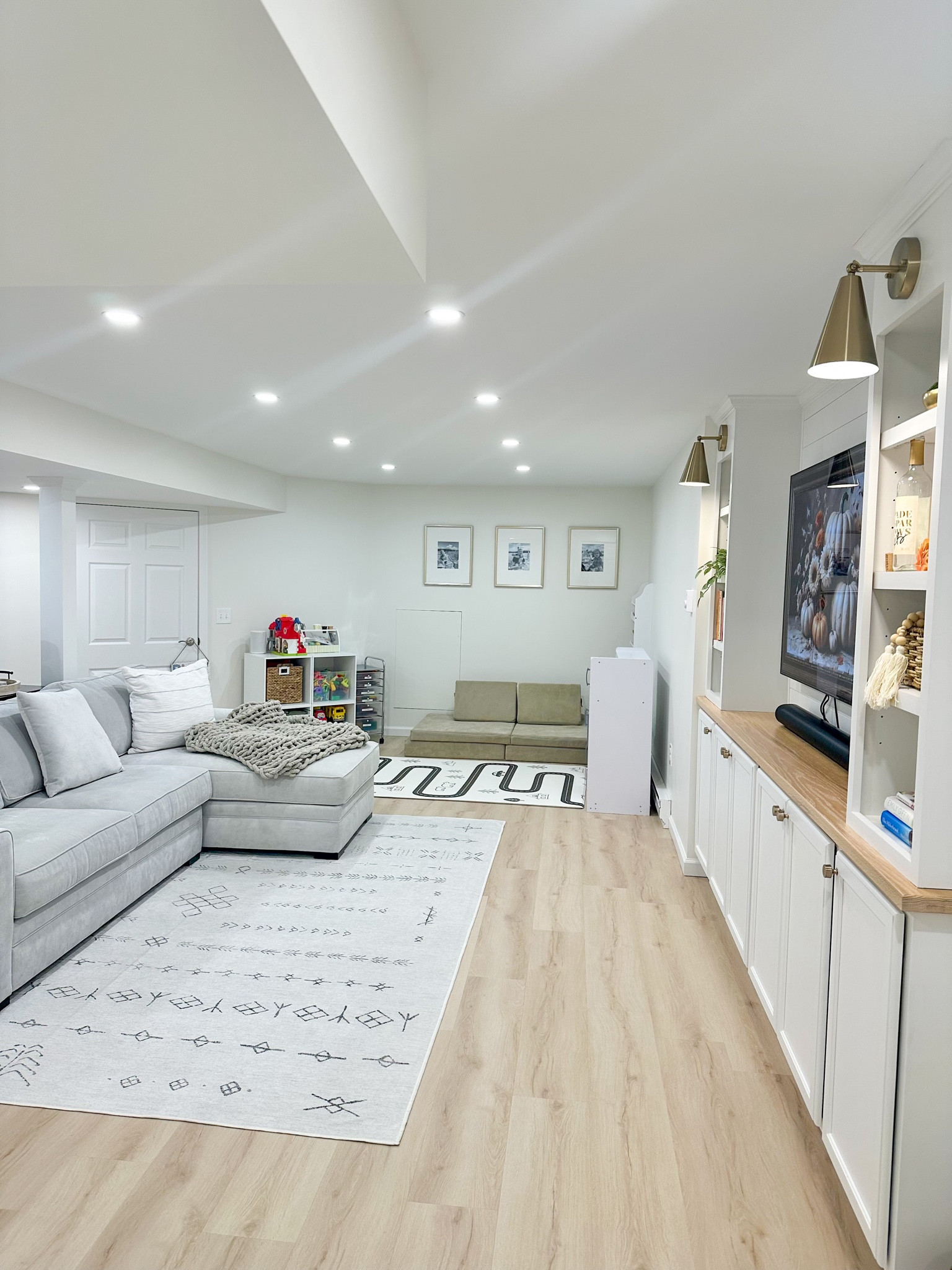 Built in bookshelves, accent lighting, gold sconces, bookshelf lighting, finished basement, playroom, gallery wall

#LTKHome #LTKxPrimeDay #LTKFamily