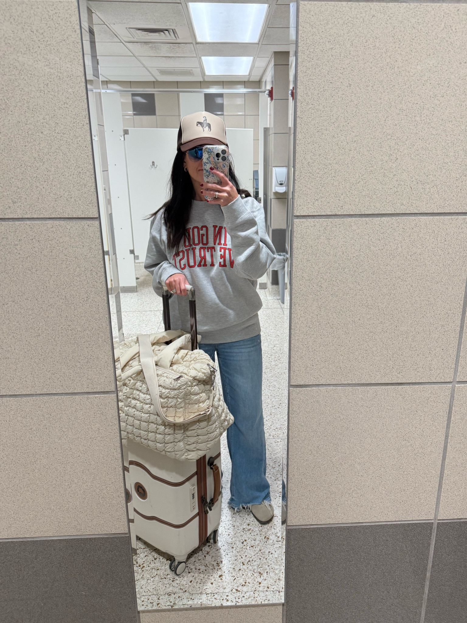 My two rules for airport travel: comfort and warmth! Jeans are soft and lightweight, size down! And my quilted travel weekender bag feels and looks luxe, but affordable! Sweatshirt and hat are unfortunately out of stock! 

#LTKFindsUnder50 #LTKOver40 #LTKTravel