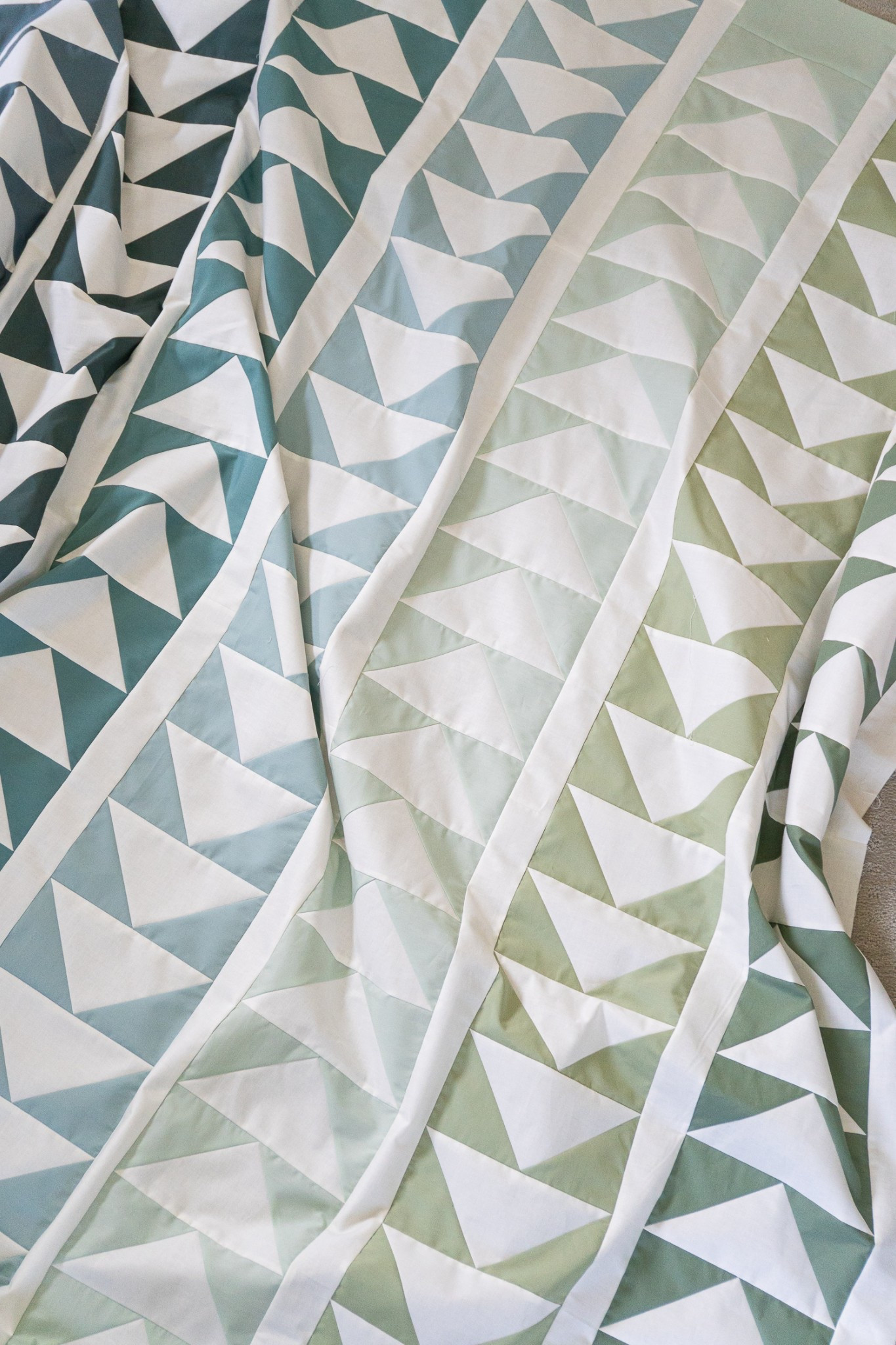 Flying Quilt sewn up in AGF solids: 
Balsam Fir,
Northern Waters,
Spruce,
Ocean Fog,
Pacific,
Fresh Sage,
Rosemary

Flying pattern in my shop:  quiltyloveshop.com