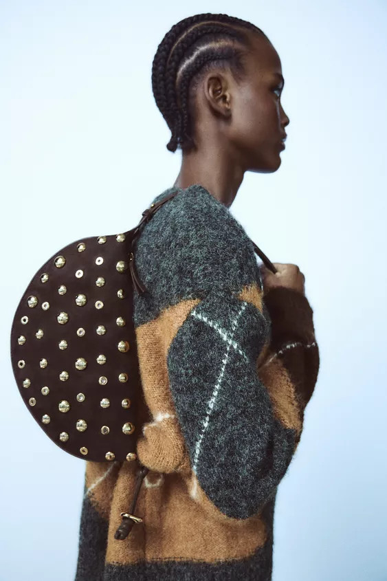 Shoulder bag. Studs around the contour. Interior zip pocket. Adjustable shoulder strap with cross... | Zara US