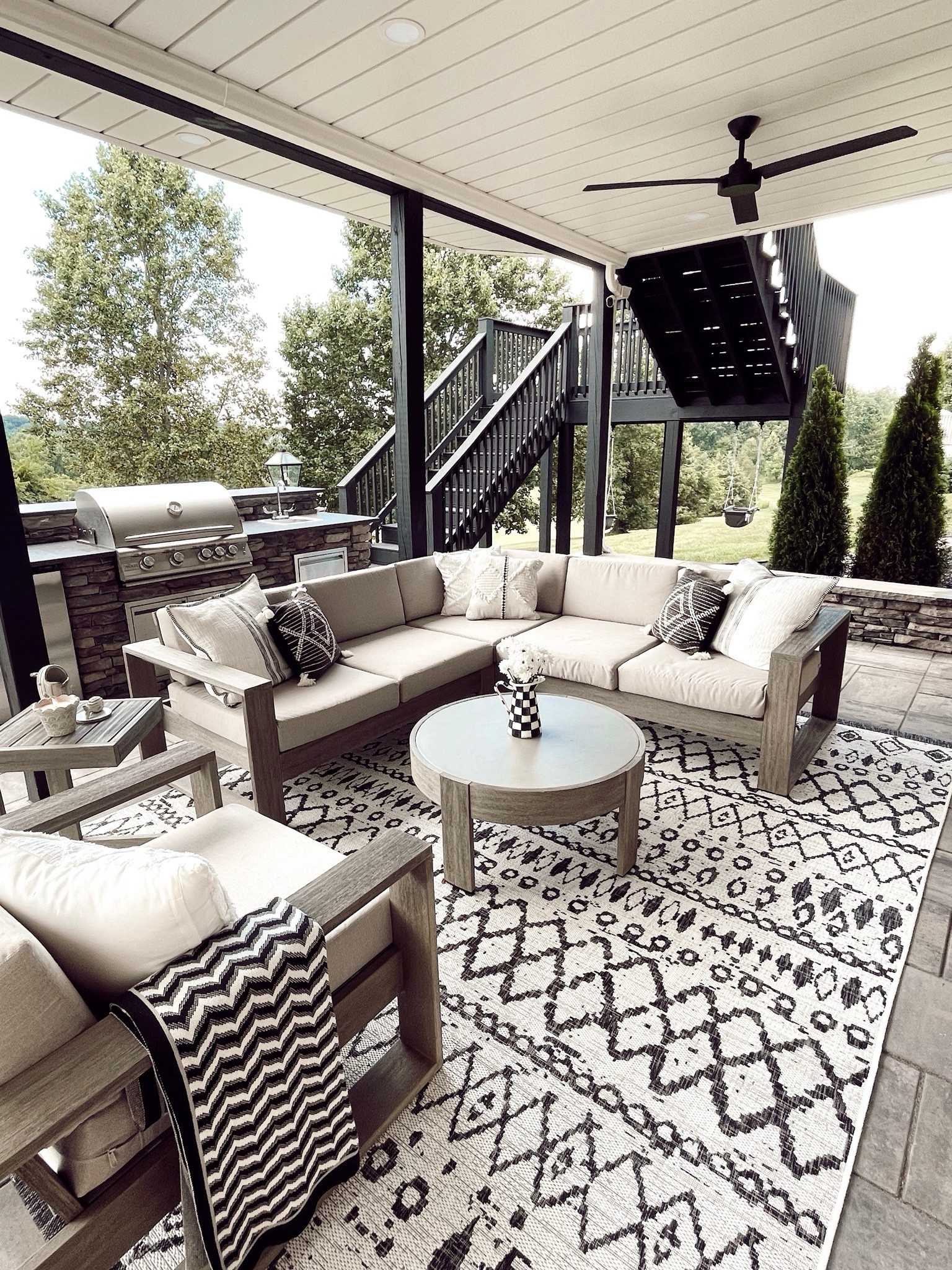 Outdoor neutral, black & white patio furniture and outdoor rug, pillows 

#LTKfamily #LTKhome #LTKSeasonal