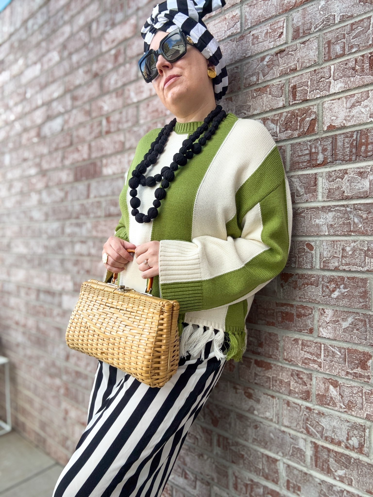 Tropical Luxe - Look 2
A curated style series

This sweater was love at first sight. The color. The stripes. The little fringe detail….I had to have it. It’s one of these statement pieces that seemingly goes with absolutely everything, as well. It comes in navy also - and I’m legit tempted. I’m loving this color green for 2026, though, so it won out.  Fit is oversized and suuuuper comfy.

If I had to pick my favorite season it would absolutely be RESORT! Okay, so it’s a clothing season and not a weather season- fine, be more specific with your questioning next time 😉 . But truly, if I could only wear one type of clothing again it would be beach-ready resort pieces. Too bad I live in a land-locked state. lol

Sweater - Simon Miller
Scarf/turban - Twisturban by Römer Millinery 
Necklace - Dillards
Bag - Vintage
Pants- (thrifted) Pretty Little Thing
Shoes - Dillards
Sunglasses - Gucci
Earrings - Vintage Givenchy
Bracelet - Vintage J Crew
Ring - Rocksboxx

Comment SHOP below to receive a DM with the link to this post on my LTK ⬇ https://liketk.it/5Zquc #ltkseasonal #ltktall #ltkootd