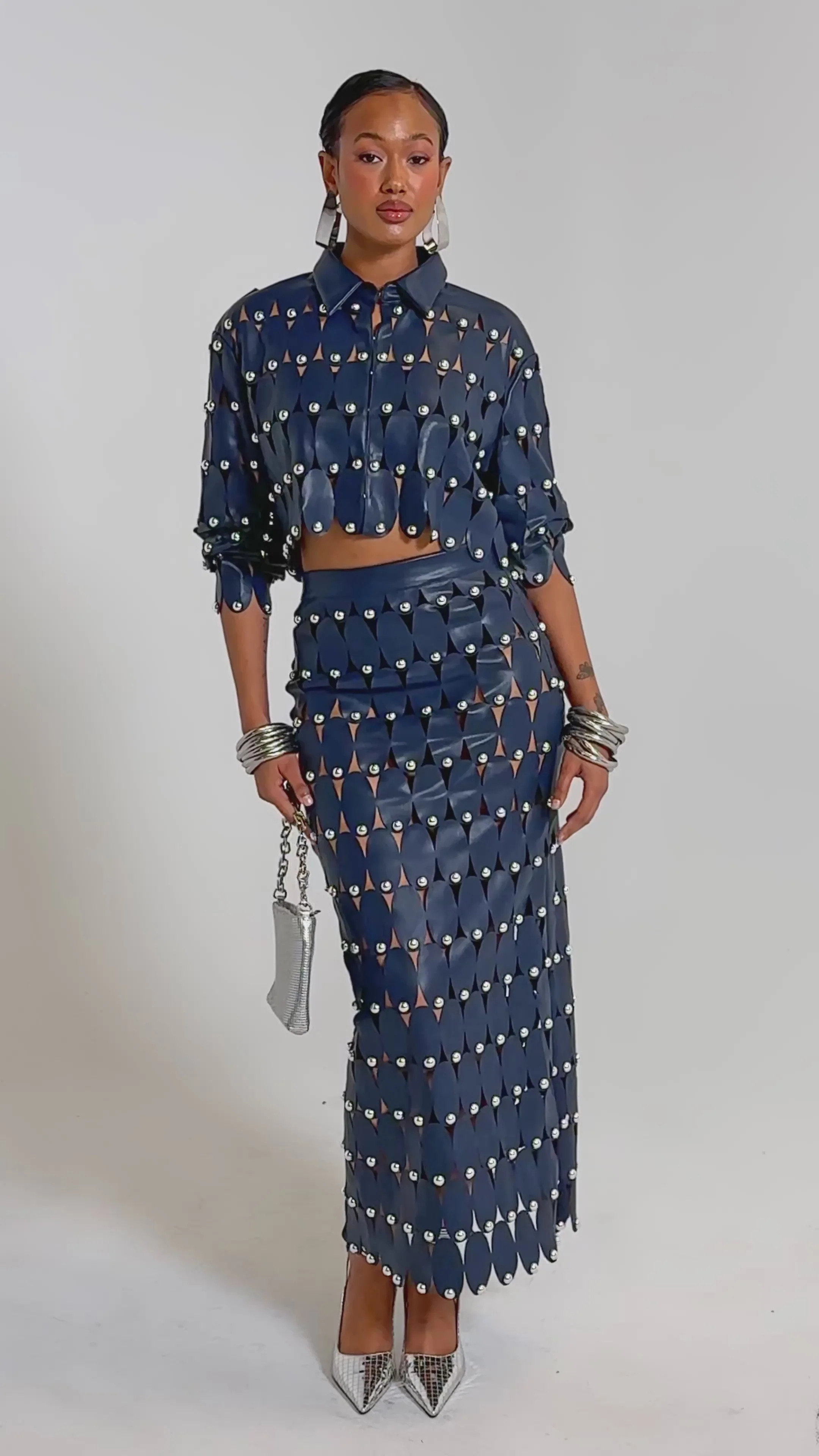 THE SNEAK PEEK STUDDED PU MIDI SKIRT IN NAVY | AKIRA