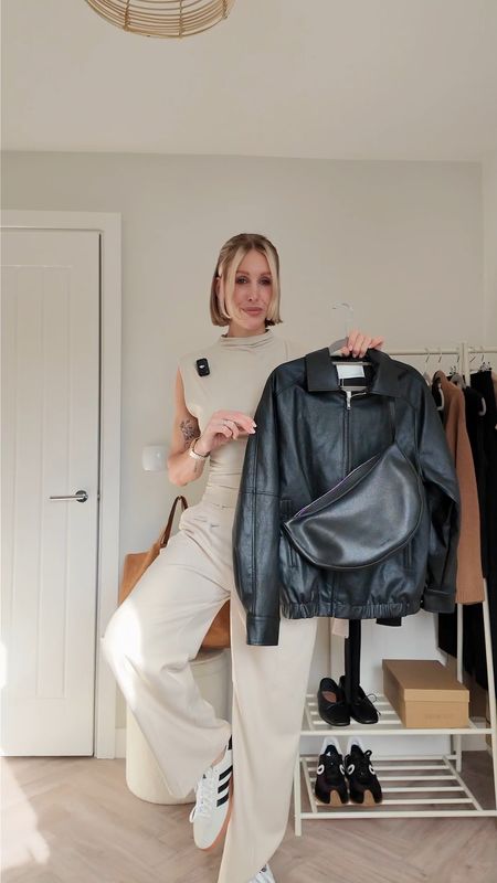 Casual 90s Hailey Bieber inspired outfit - wide leg trousers - vegan leather bomber jacket - Adidas Spezial #90s #casual #adidas 

#LTKVideo #LTKshoecrush #LTKfindsunder100