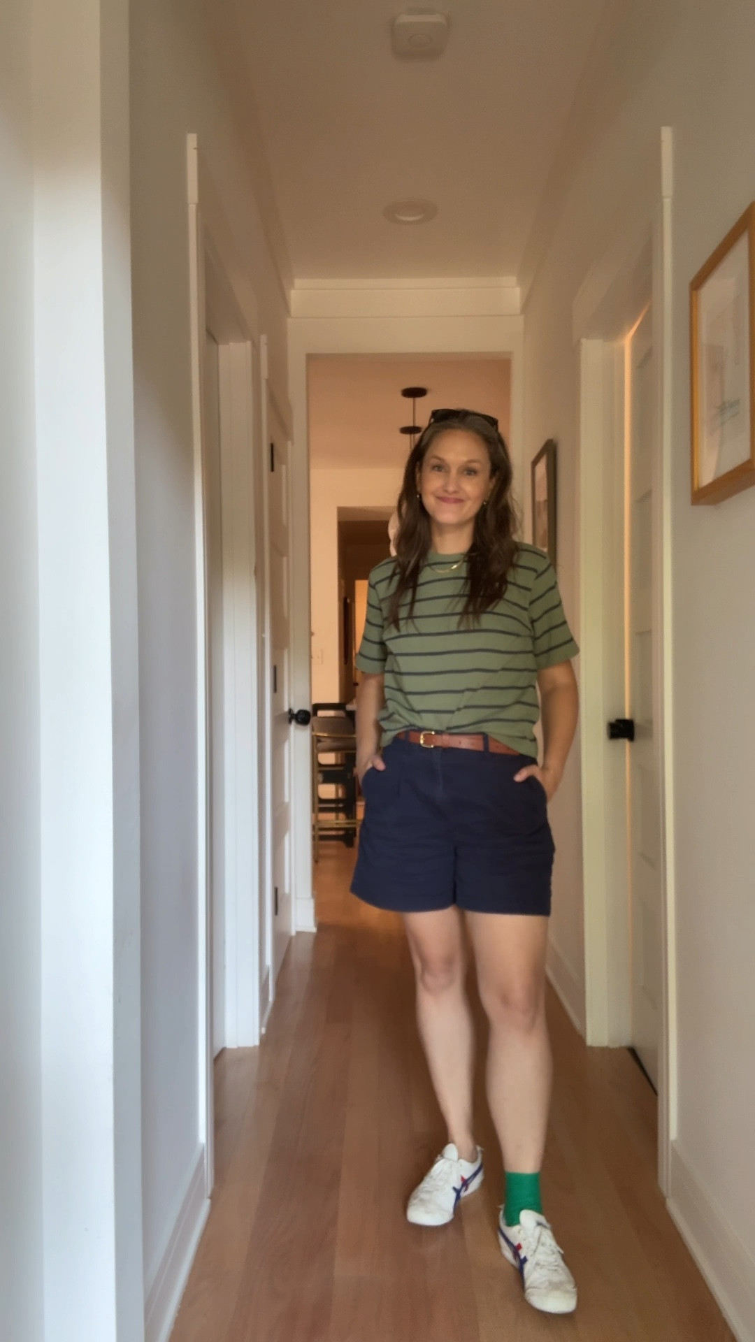 Monday in Chicago, our cool city mom slips into navy pleated shorts and a green-and-navy striped top, her favorite sneakers ready to carry her through a slow-but-steady return to routine, gold hoops glinting in the morning light, her herringbone necklace and stack of permanent bracelets—minus the one that broke off last night, now added to her ever-growing to-do list—clicking softly as she walks. After a whirlwind week in Disney where posting daily outfit photos (or, let’s be honest, anything at all) went out the window, followed by a sinus infection that laid her flat until antibiotics arrived, she’s finally back among the living—only to be hit with news from her podiatrist about her oddly shaped ankle bone that explains the slow healing of past injuries. Who knew? At least there are answers now, so she takes a deep breath, adjusts her bracelets, and keeps moving forward, one carefully measured step at a time.

#LTKStyleTip #LTKTravel #LTKFamily