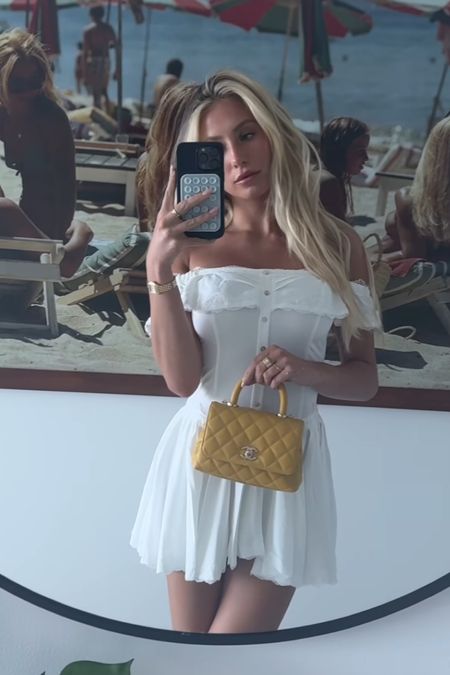 Shop Alix Earle's white ivory off the shoulder smocked mini corset waist lace trim dress #Alixearle #CelebrityStyle

#LTKStyleTip #LTKTravel #LTKSaleAlert
