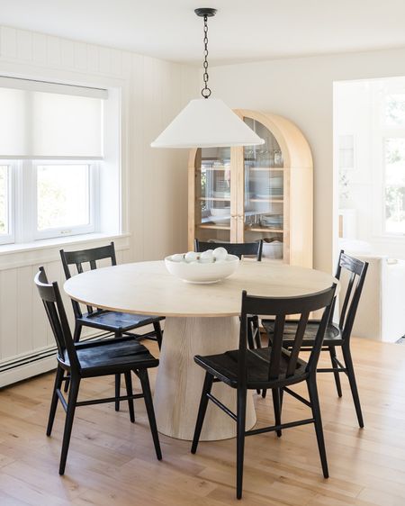 Bright and airy dining nook with the perfect amount of contrast. We used a white oak dining table with black oak chairs paired with a plaster pendant to create an airy, yet grounded vibe. The arched cabinet holds all of our favorite things for entertaining and serving dinner.

Shop the look and follow @pennyandpearldesign for more interior design and home style✨



#LTKFind #LTKhome #LTKstyletip