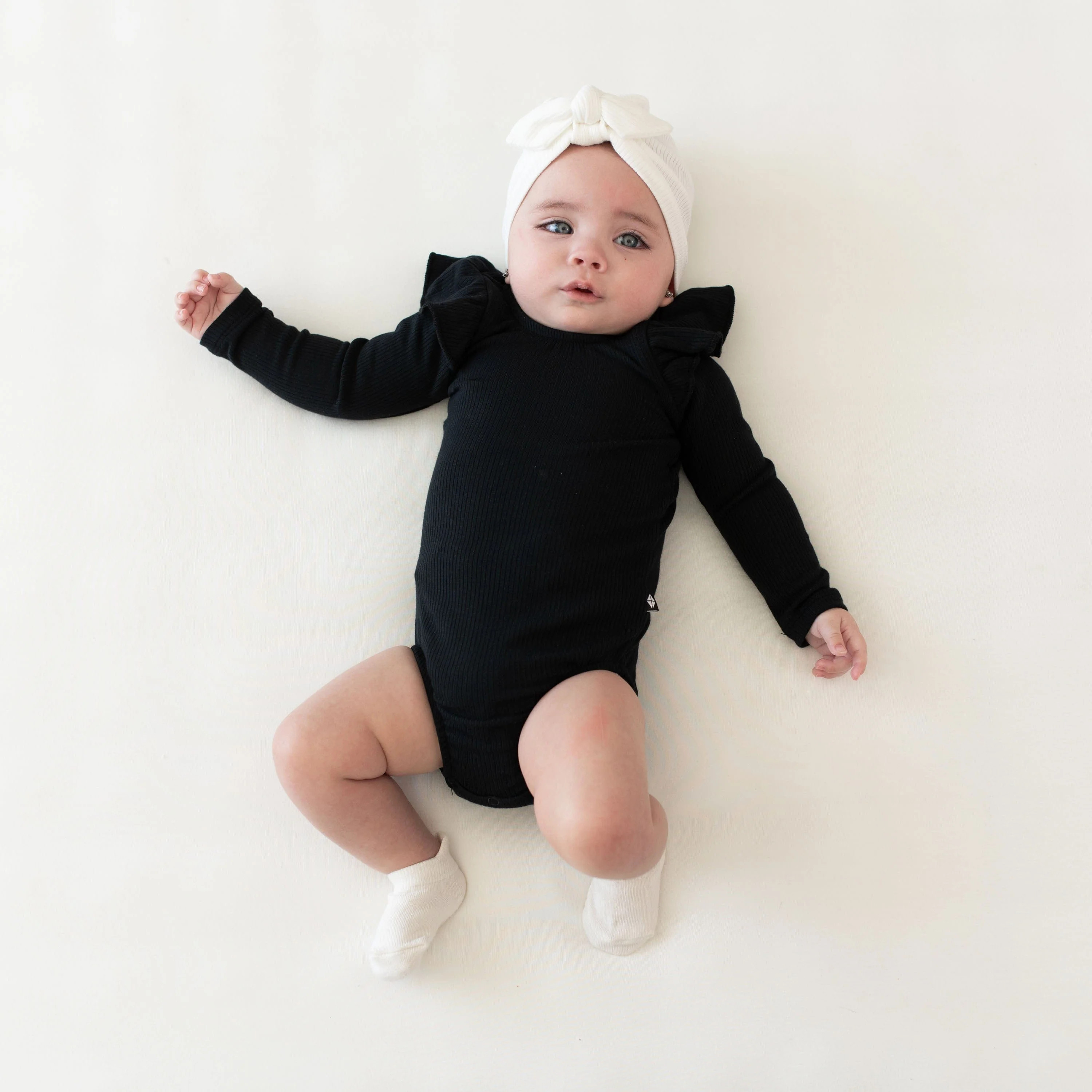 Ribbed Long Sleeve Ruffle Leotard in Midnight | Kyte BABY