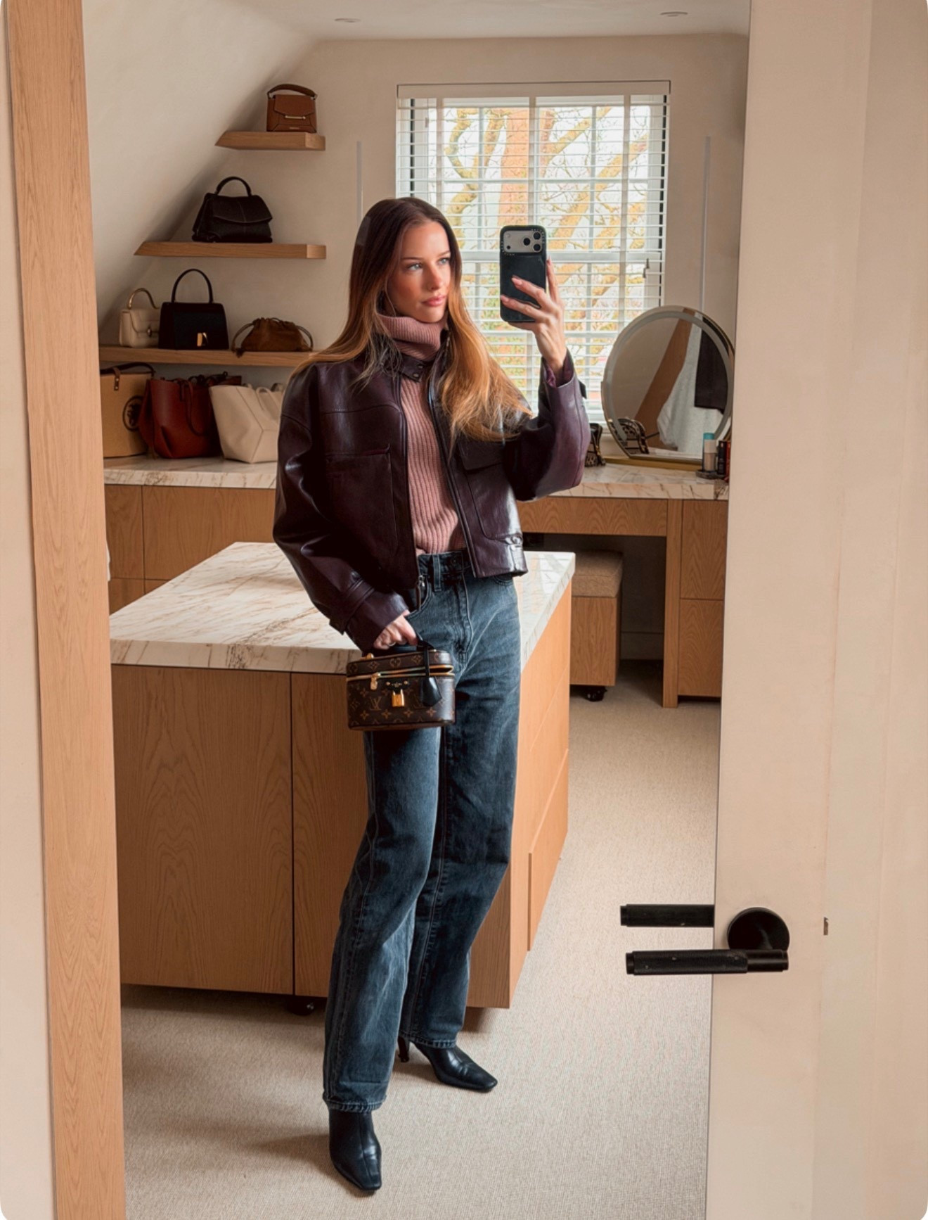 Black jeans and a cropped burgundy leather jacket

#LTKwinter #LTKeurope #LTKjeans