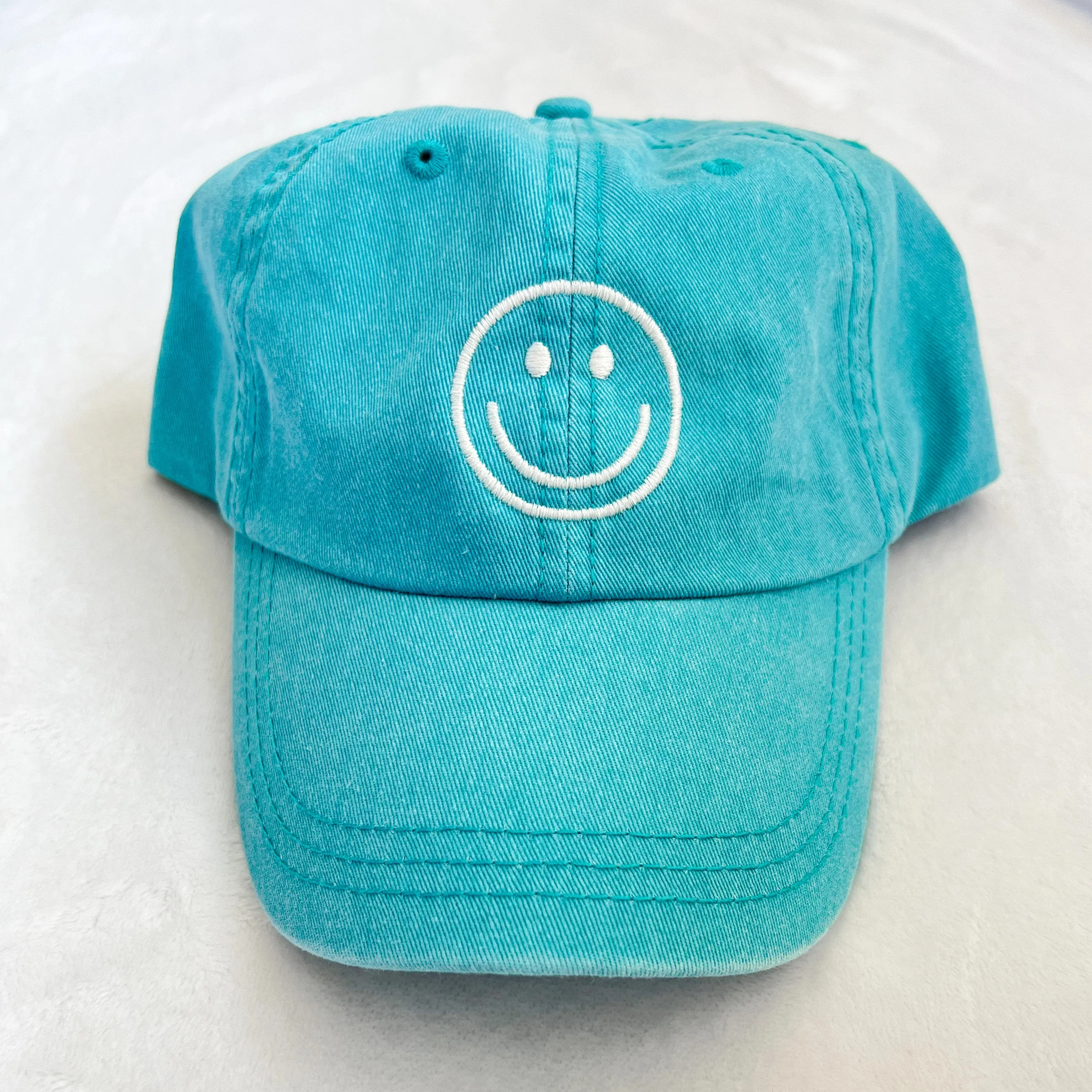 smiley face hat | aqua | Reef rain aria