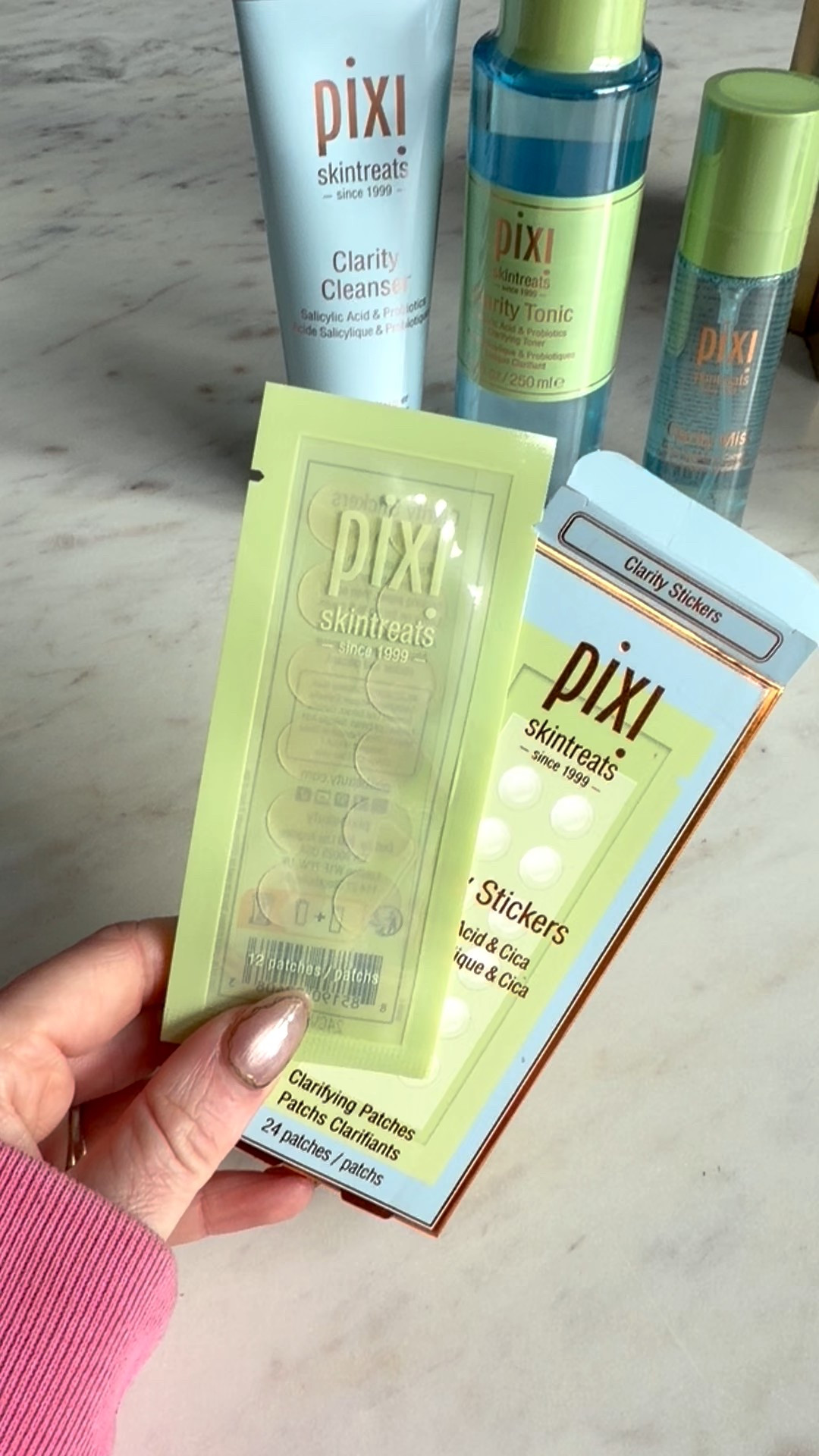 Pimple patches and blemish clarity stickers with salicylic acid and cica, these clarity stickers are discreet and perfect for treating pimples, zits, and acne on the go, available at Target Pixi beauty clarity line 