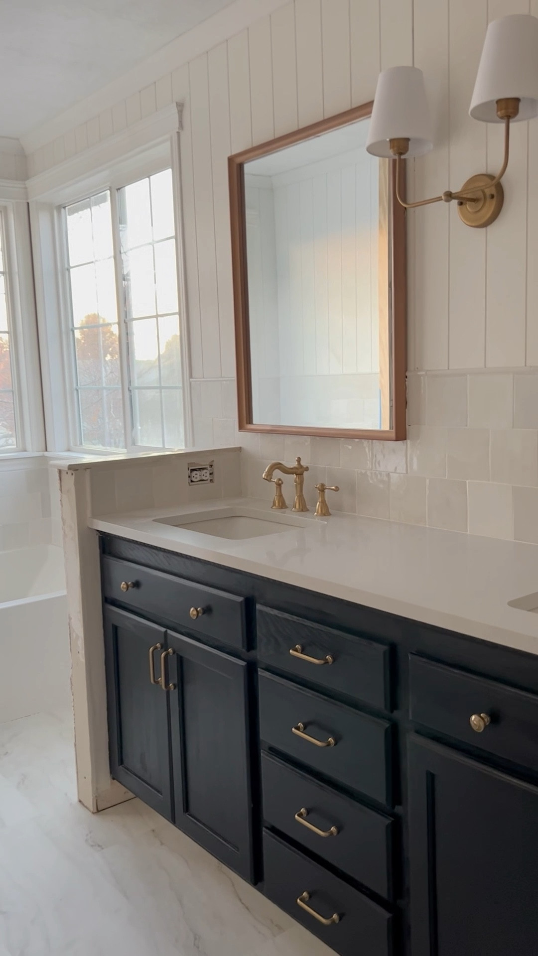 Bathroom renovation // cabinet hardware // bathroom lighting // heritage faucet // brass // gold // backsplash // vintage // interior design ideas // classic 

#LTKhome #LTKunder100