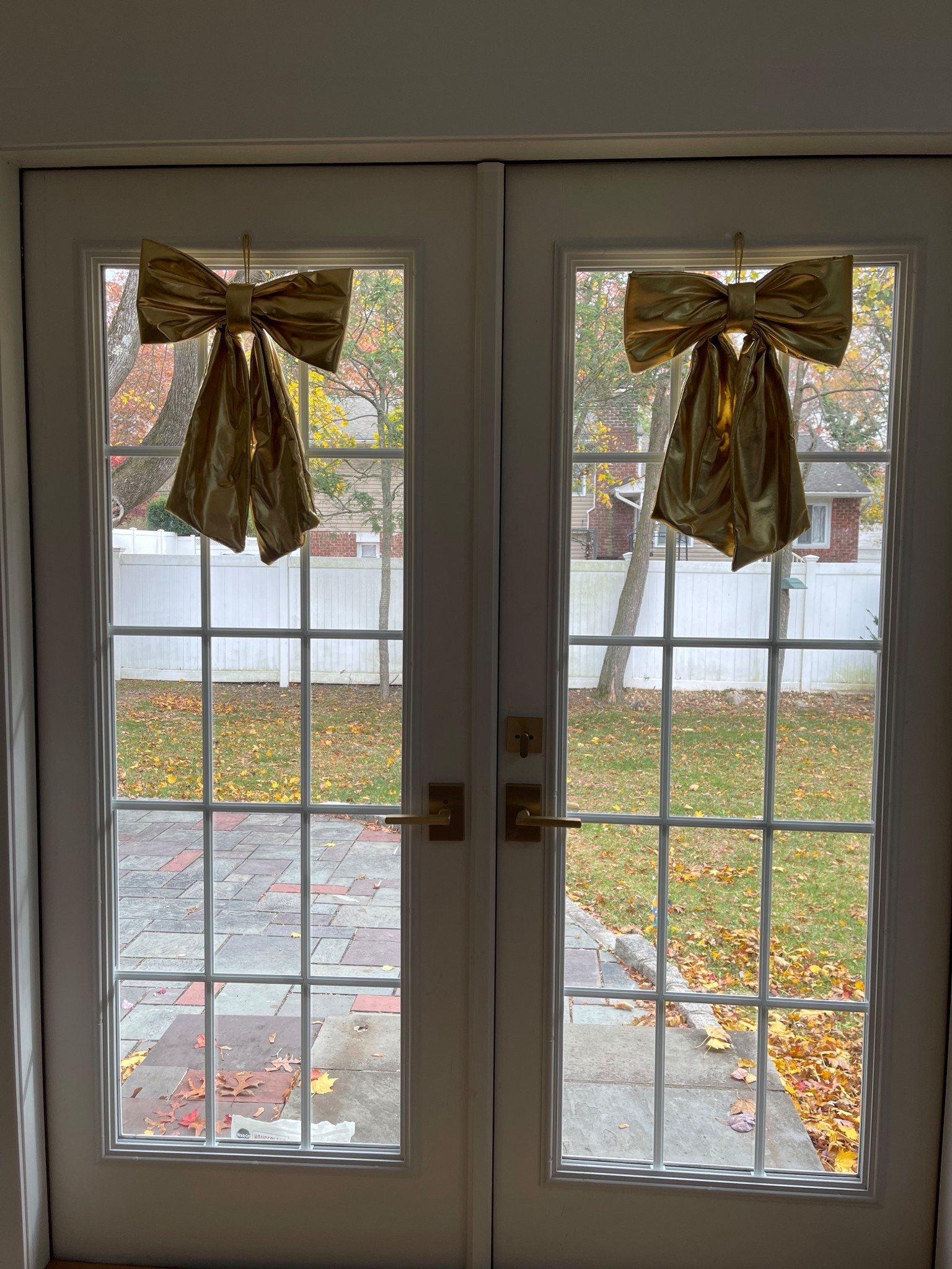Gold bows decorating our French doors!

#LTKHome #LTKHoliday