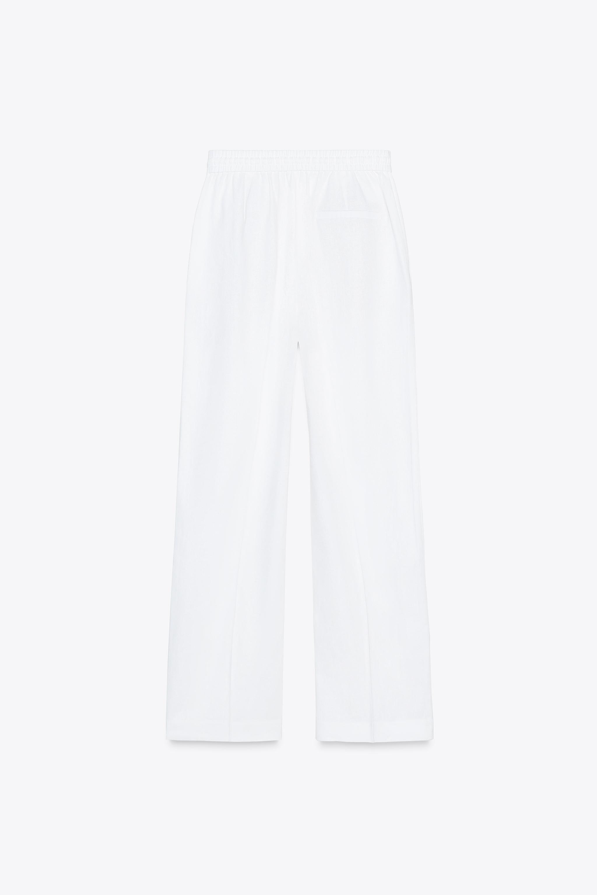 Linen blend pants. High waist with adjustable elastic drawstring waistband. Front pockets. Straig... | Zara US