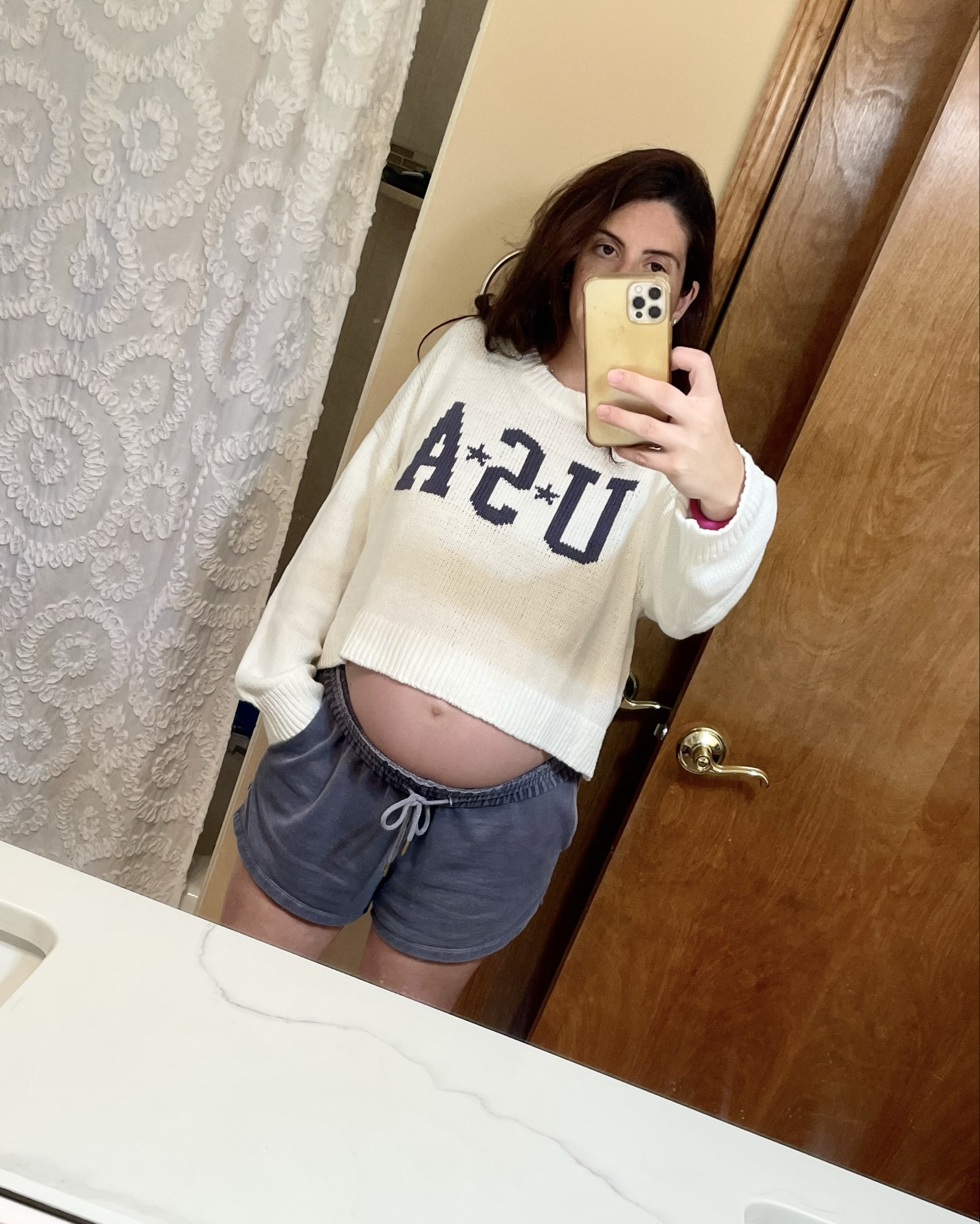 4th of July comfy clothes. Love this lightweight but cozy sweater! It’s a cropped fit and I’m wearing an XL at 8 months pregnant (normally  wear a small when I’m not pregnant). #USA #sweatshorts #shorts #comfies #july4th #maternity #bumpfriendly #bumpstyle

#LTKStyleTip #LTKFindsUnder50 #LTKBump