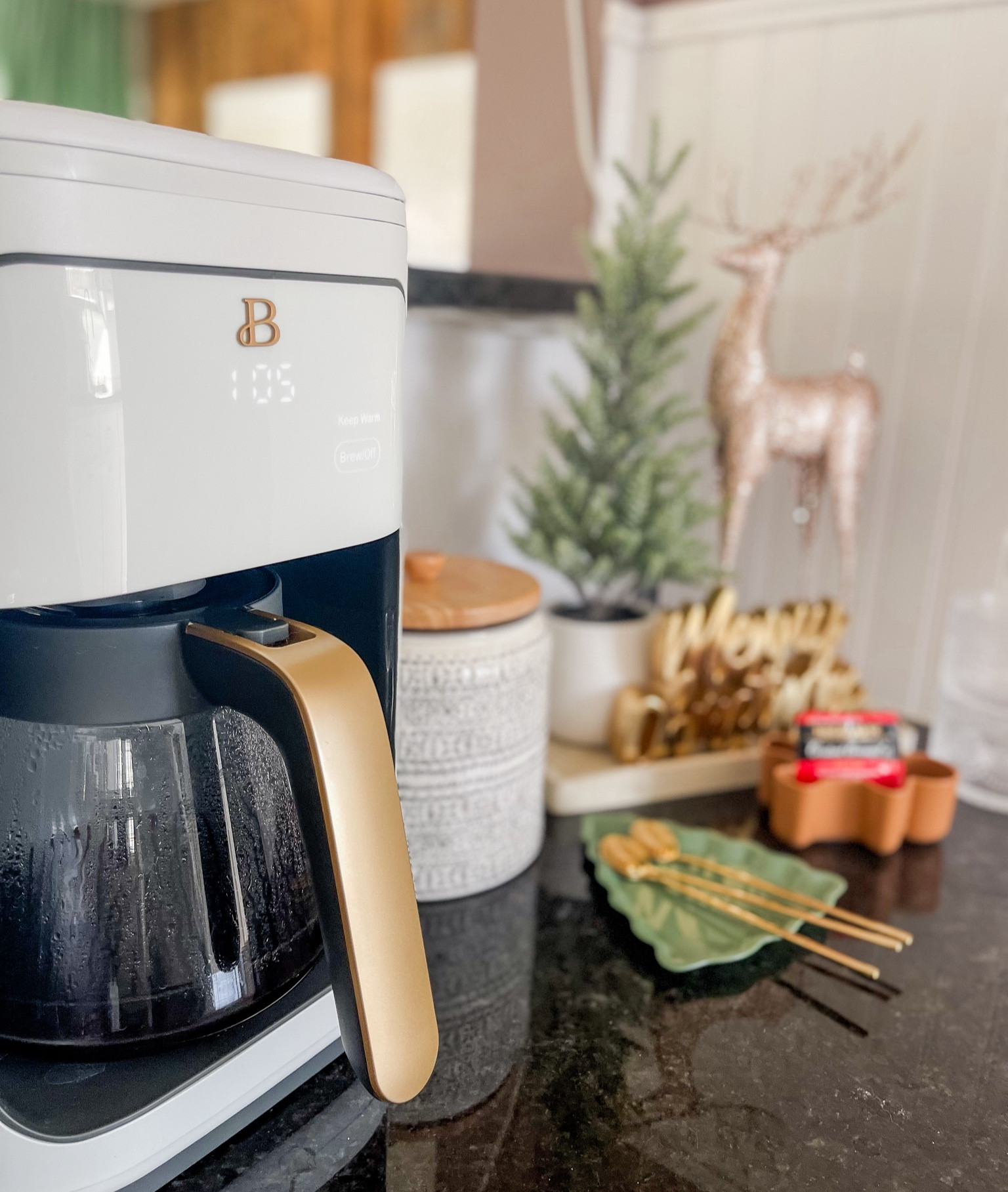 Coffee nook all set for my Christmas guests. 🎄☕️ My new coffee pot is just ✨glamorous✨ and I love that she can brew up to 14 cups at a time with three different brew strengths  

Additional products without links: the rose gold reindeer and Merry Christmas sign are from Hobby Lobby 2023, the coffee canister is from Target (usually available seasonally during spring and summer), the tree was a HomeGoods find, and the green tree tray is Target Dollar Spot! 

Similar items linked to those mentioned above. 💕 #ltkholiday 

#LTKSeasonal #LTKfindsunder50 #LTKhome