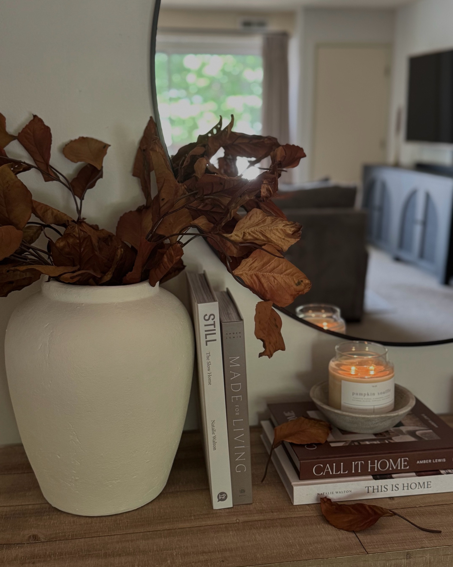 Fall console table, candle bowl, wood console, Wayfair console, round mirror, hd mirror, urn vase, terracotta vase, fall magnolia stems, fall stems, fall florals, fall decor, coffee table books, brown book, candlesticks, pumpkin, terracotta pumpkin, cement pumpkin, brown candlesticks, stripe ottomans

#LTKSaleAlert #LTKSeasonal #LTKHome