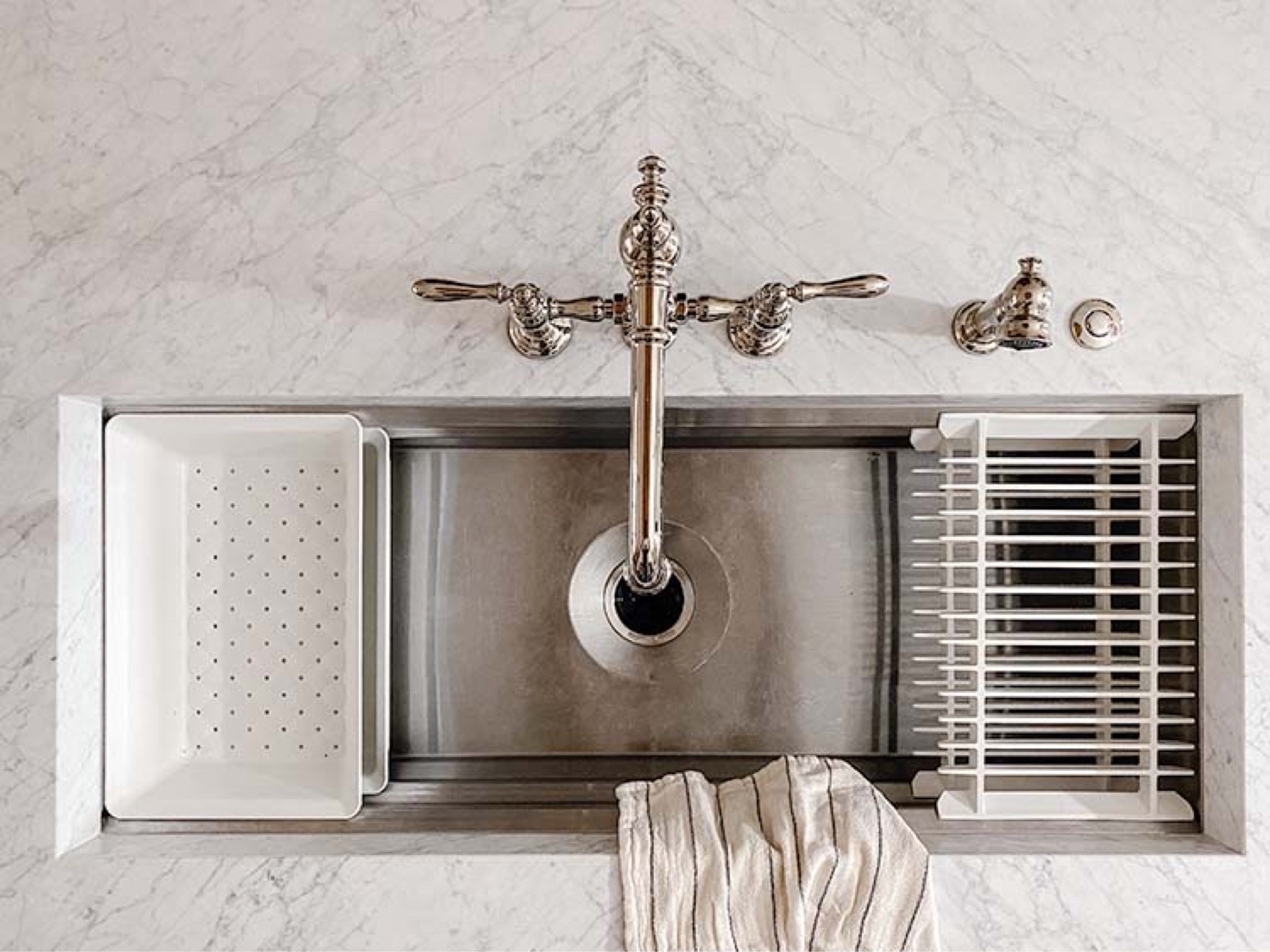 Polished nickel meets stainless steel in our kitchen sink. Polished nickel has a warm undertone. This is why it pairs really well with brass. If you already have a lot of brass, and you're ready to start mixing metals, start with polished nickel. Almost all of the faucets in our house right now are polished nickel.

Kitchen sink, faucet 

#LTKhome #LTKstyletip #LTKfamily