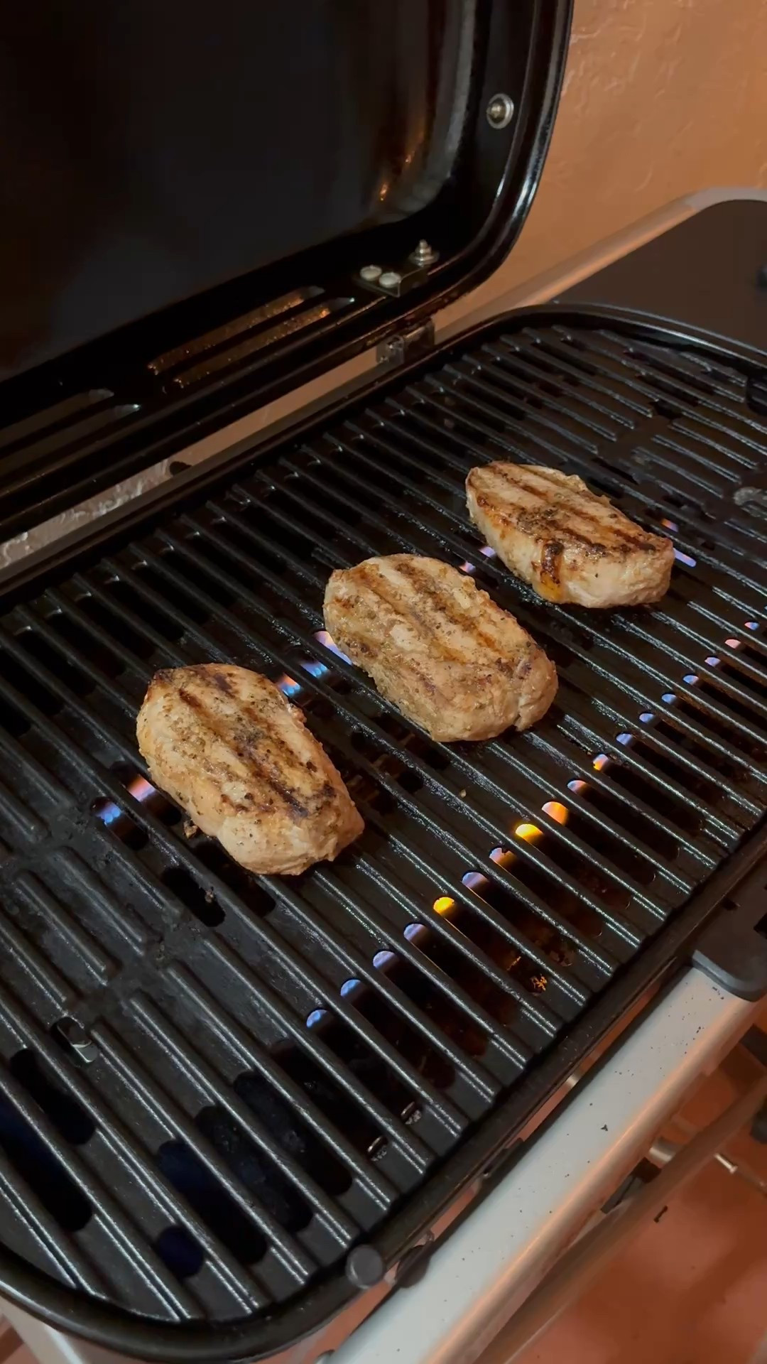 Grilling pork chops on our portable Weber grill 

#LTKdayinmylife #LTKHome #LTKfoodie