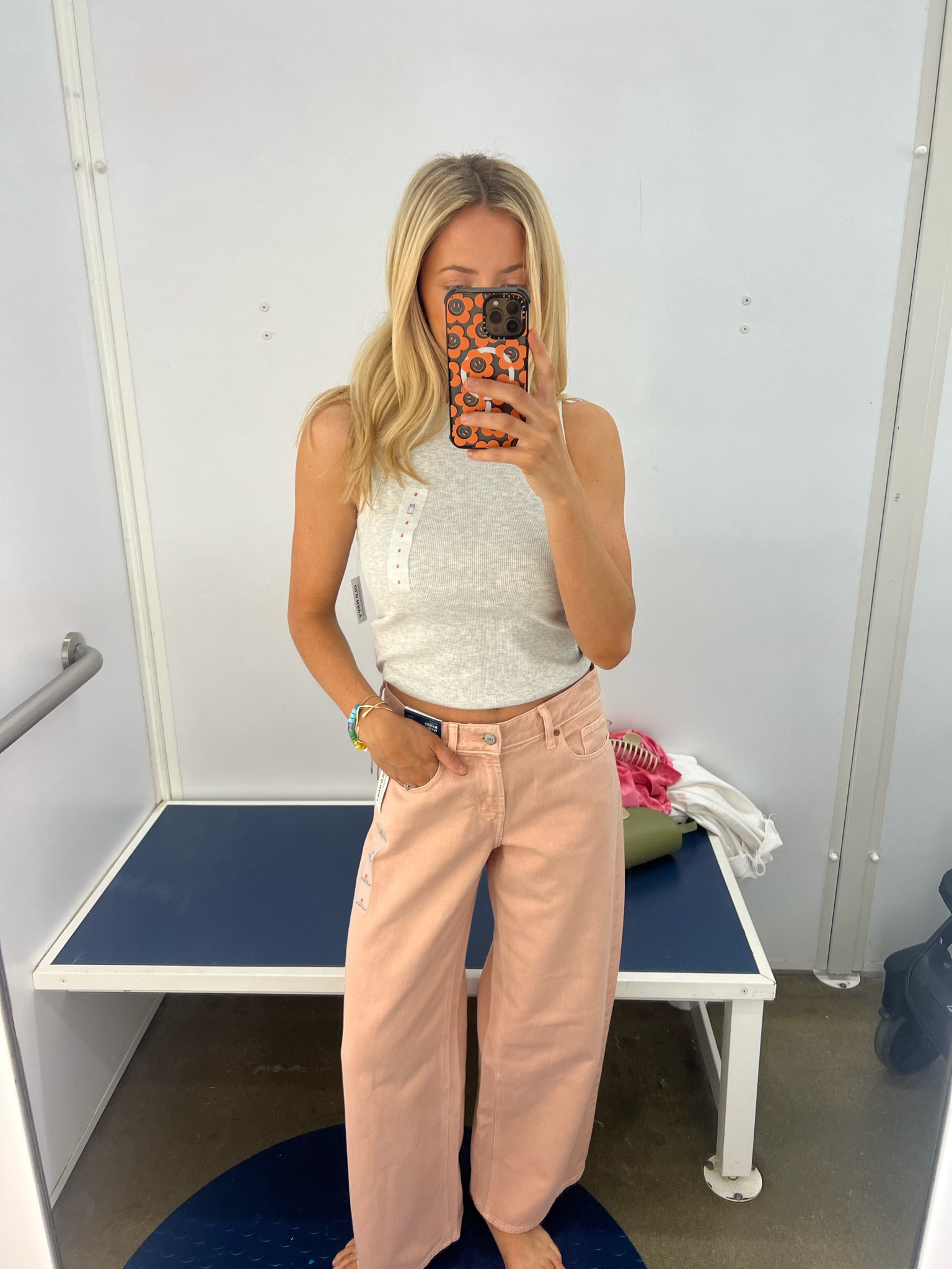 Size small in tank 
Size 0 in denim. They run baggier & mid rise 