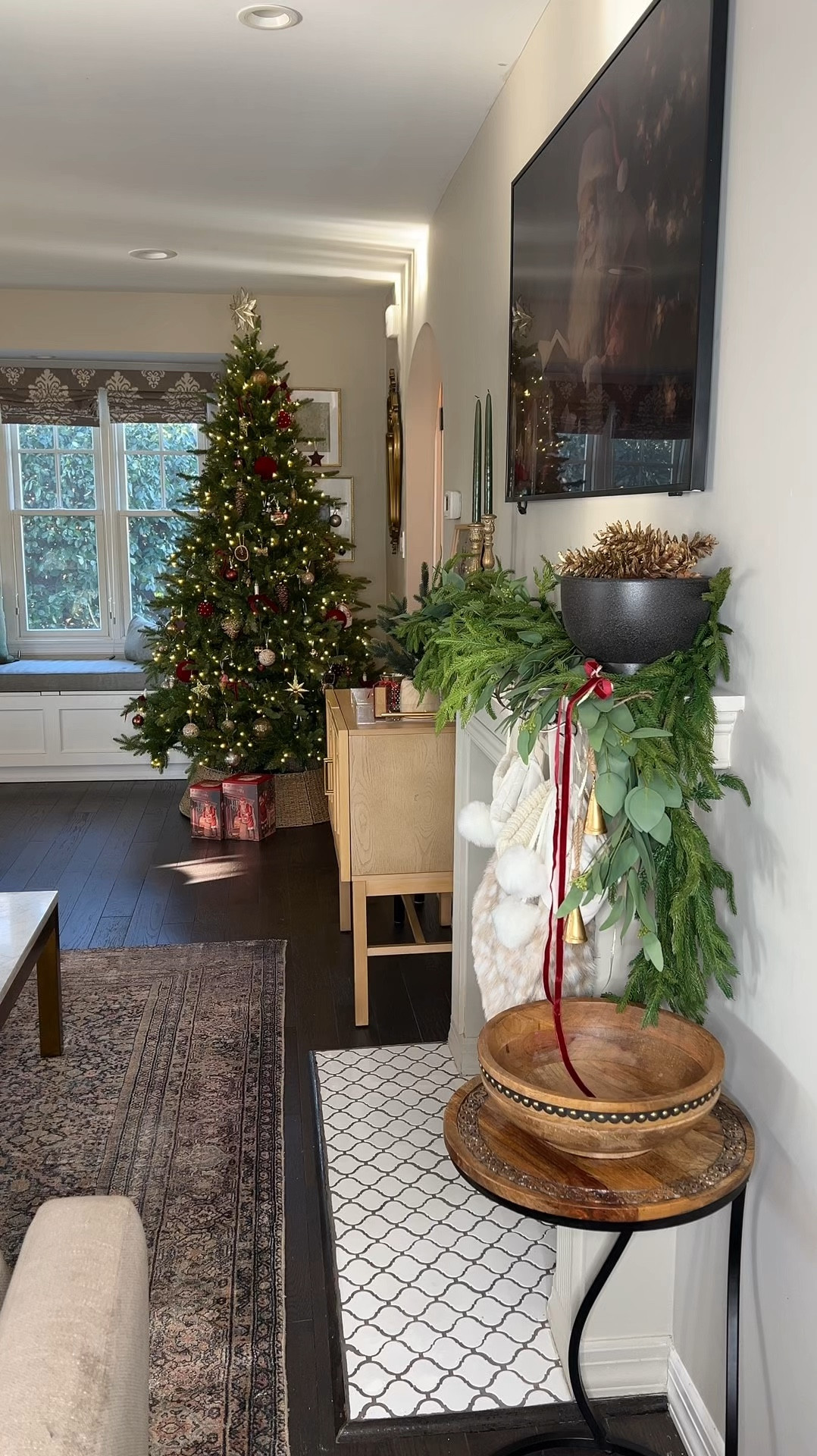Christmas living room 

Christmas tree, tree collar, Christmas garland, velvet ribbon, Christmas ornaments, Loloi rug. 

#LTKHome #LTKHoliday #LTKSeasonal