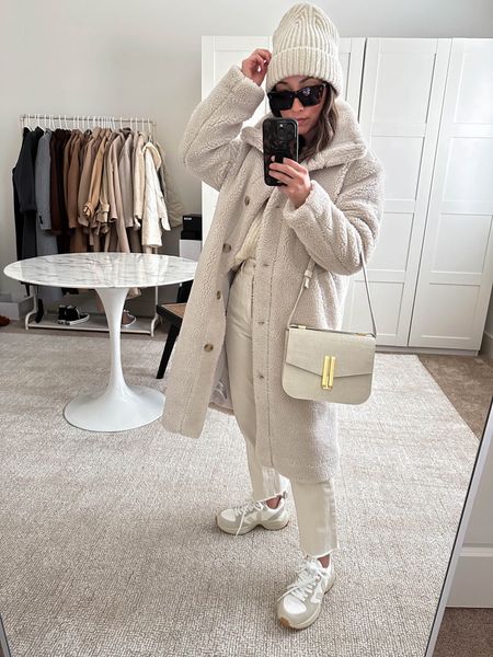 White monochrome outfit. Coat is old Gap. This DeMellier bag can be worn as a crossbody too. 

Coat - Gap petite xs
Sweater - Jenni Kayne xxs
Jeans - DL1961 25
Sneakers - Veja 36. Runs small, size up. 
Beanie - Scoop 
Sunglasses - Celine
Bag - DeMellier 

Petite style, tonal style, neutral outfit, capsule wardrobe, minimal Style, street style outfits, white Sherpa coat, white bags, Veja sneakers styled, all white  outfits. 