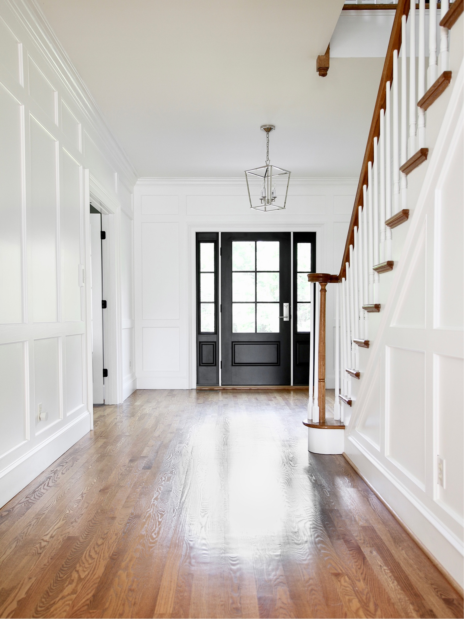 One of the reasons I chose this house was the practical and charming entryway and hallway. 
Instead of a two story tall entry there are 9’ ceilings allowing for a functional loft area. 
This was my original polished nickel 4 light pendant from McGee and Co

#LTKhome #LTKFind #LTKstyletip