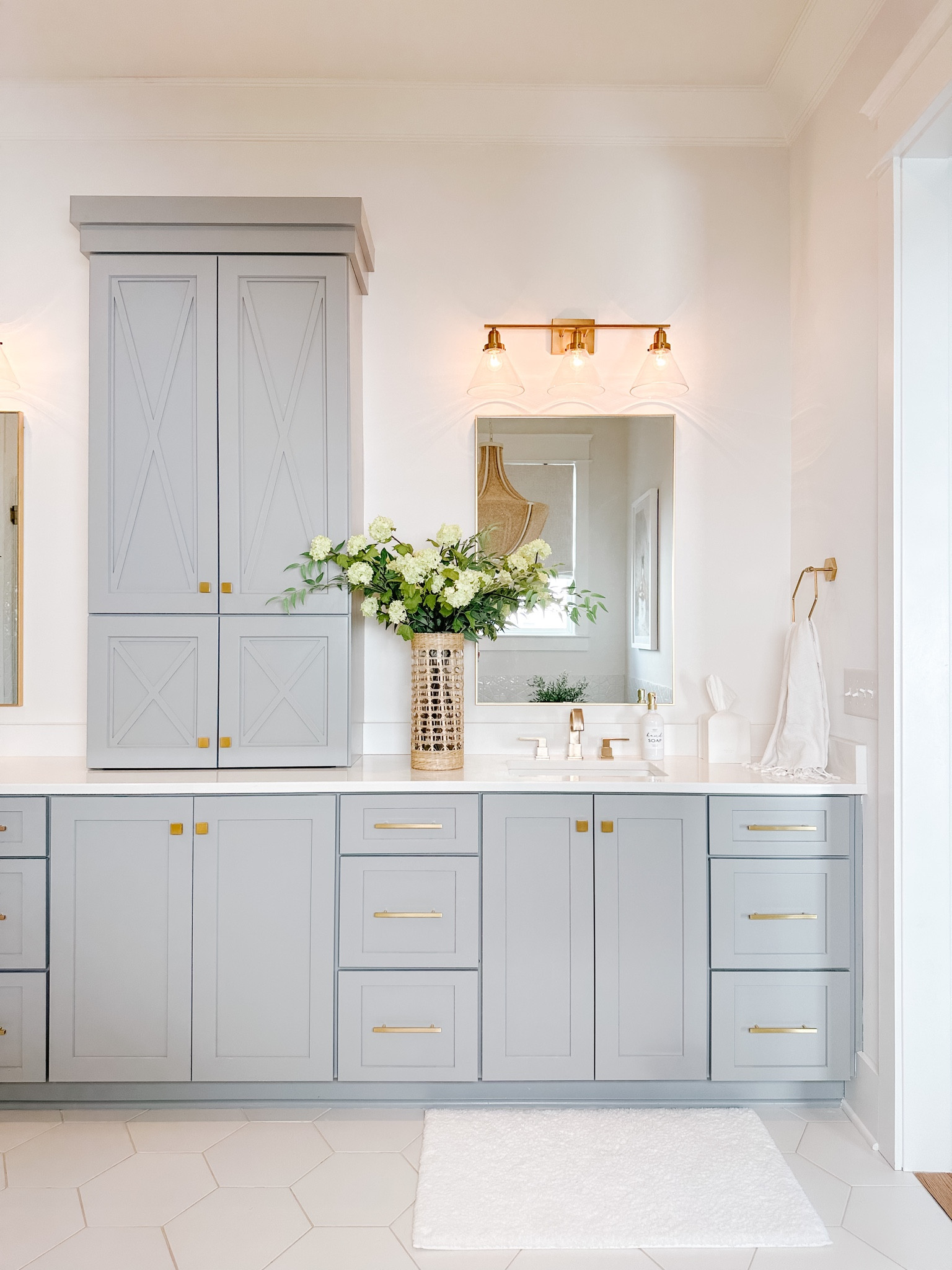 Bathroom, primary bathroom, master bathroom, bathroom decor, coastal bathroom, blue bathroom, towels, towel rack, gold trashcan, gold hardware, mirror, gold mirror, bathroom mirror, vase, rattan



#LTKstyletip #LTKSeasonal #LTKhome