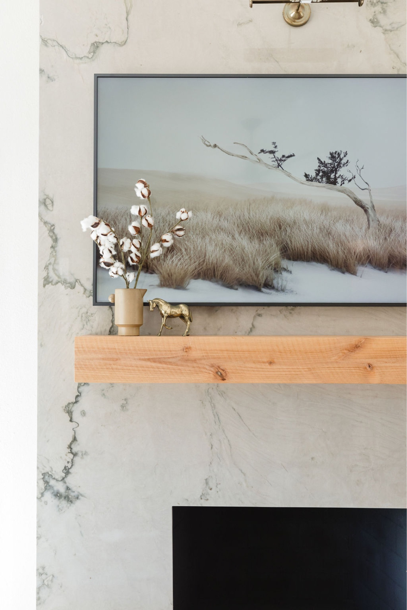 Farmhouse mantle with a rustic fireplace mantle, Frame TV and home decor. 

Living room, fireplace, home decor, interior design 

#LTKunder100 #LTKhome