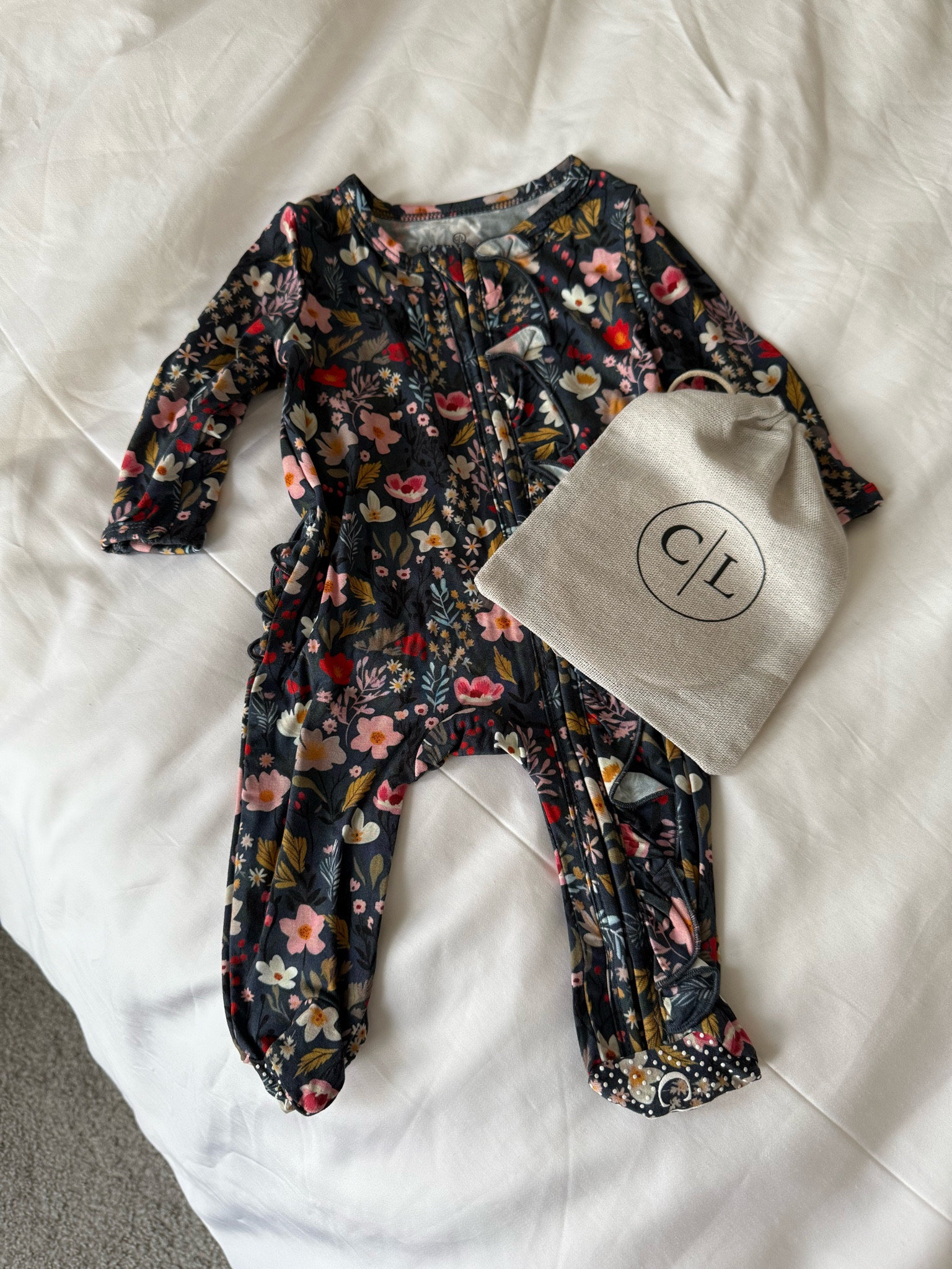 The cutest little zipper footie (bag is holding her little name sign) 

#LTKBaby #LTKFindsUnder50 #LTKBump