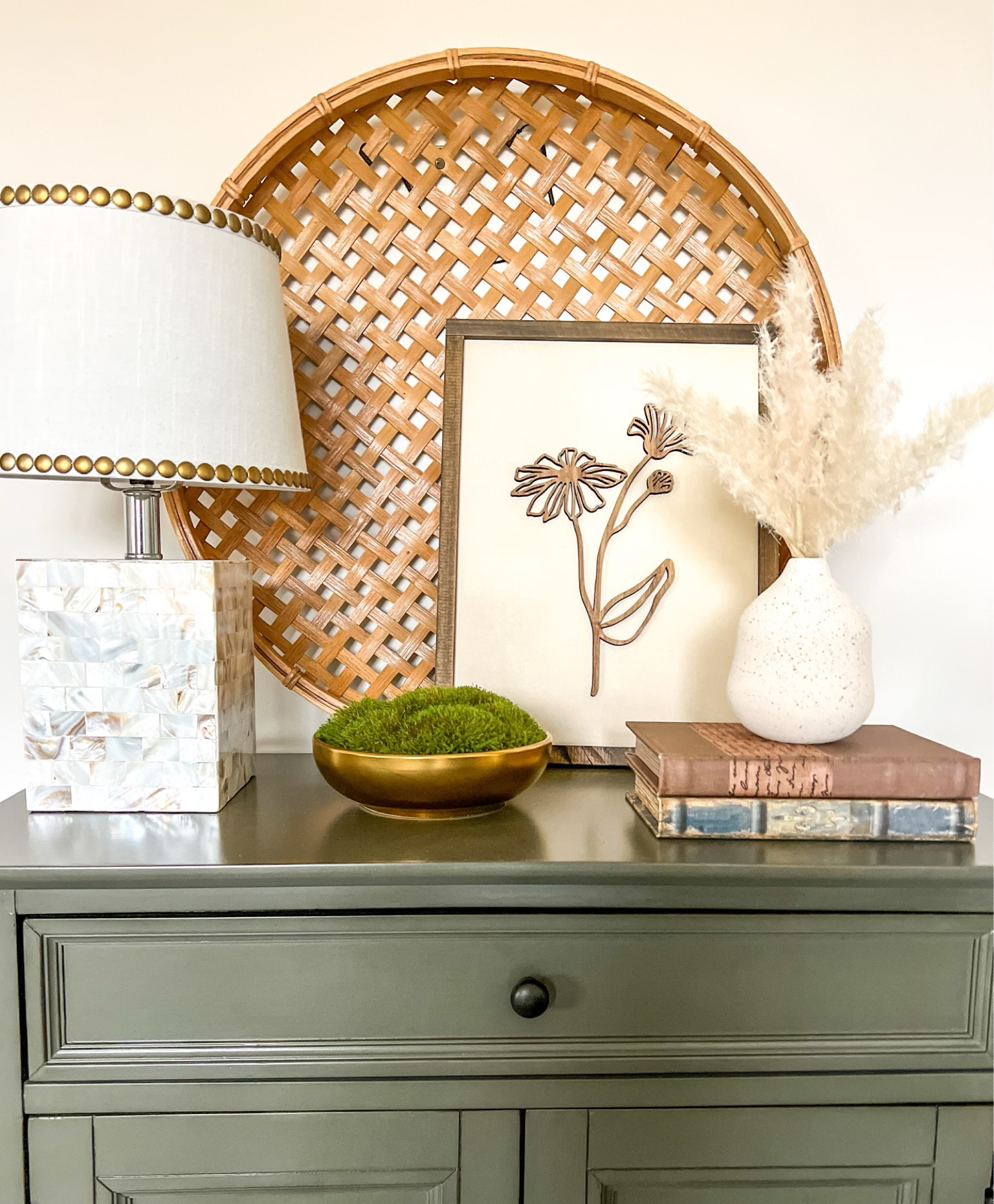 Here’s a great “get the look” for you. We snapped this quick pic after styling a client’s  entryway and gathered these links so you can recreate it in a snap. Tone-on-tone neutrals, texture and dimension make this work. It’s effortlessly timeless and oh-so-2024. 🫶🏼 Wayfair, Target, lamp, brass bowl, decorative bowl, decorative moss, antique books, decorative books, pampas grass, ceramic vase, small vase, basket wall decor, neutral art, foyer table, green table, neutral home decor, boho decor, wall decor, table styling, how to style, entryway decor, ceramic vase, bud vase

#LTKhome #LTKfamily #LTKstyletip