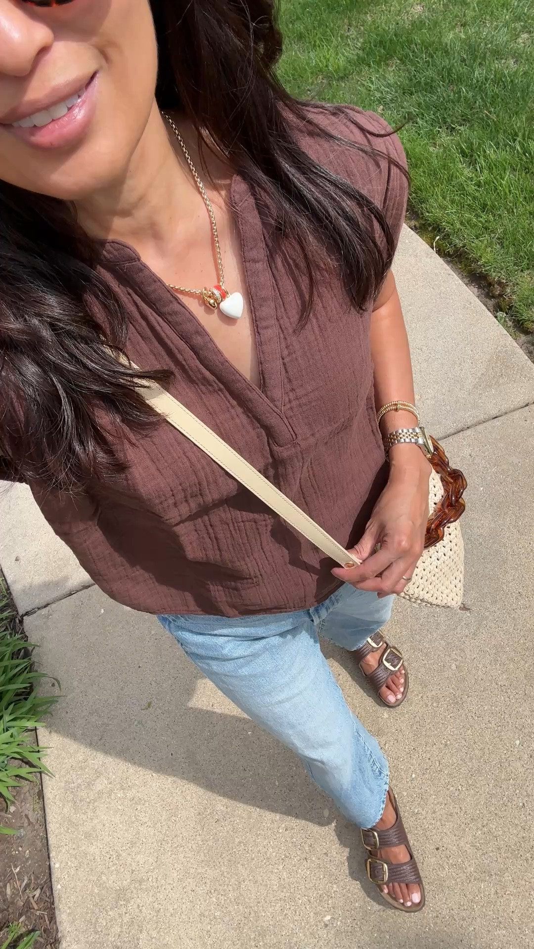 What I wore today: gauze top and jeans. 
- I love the comfort and easy style of a cotton gauze piece. This exact top is currently on sale for $15. One of my favorites to pick up as I need them year after year.  True to size. 
- Barrel jeans with ankle length that makes it good for warmer months. I size up. Exact wash: I confess. 
- New texture in my favorite Birkenstock style that I got for Spring Break. Chic combo of raffia texture and big gold buckle.
- I am trying to branch out with my sunglasses style and I like these oval lenses. Great quality too. I also have and love in black. 
- Favorite chunky charm necklace from last year. Customizable. 
- Elastic bracelets with colorful little charms. 
- Woven crossbody bag with tortoise chain accessory  


#LTKOver40