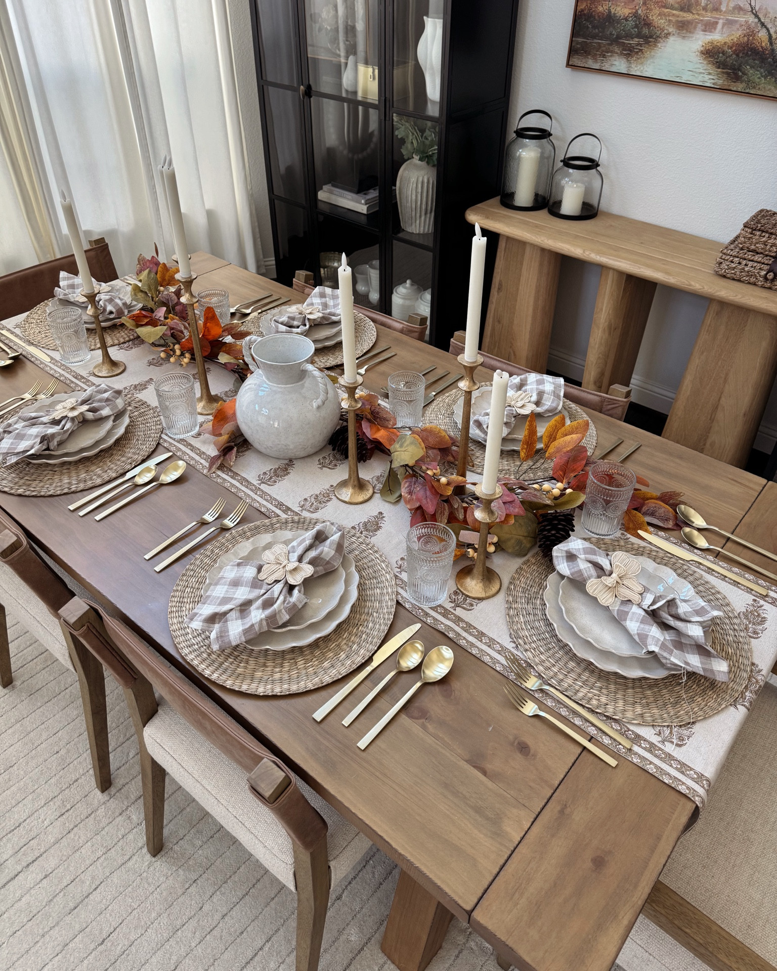 Tablescape Home Idea 🤍

+ leafy garland: Amazon (I cut off the red berries to make it more the vibe I wanted)
+ runner on my table: pottery barn
+ plates: world market
+ napkins and chargers: Target
+ candle holders and candles: Amazon
+ flatware: Walmart
+ vase: Amazon (also sold at Magnolia and McGee and Co)
+ glass cups: Amazon 

I planned on faux stems in this vase but they are taking forever and I actually love how simple but beautiful this all feels. Could add some fresh flowers in there from Trader Joe’s too 😏 everything saved in the link in my bio!


#thanksgiving #decor #table #diningroom #diningtabledecor 



#LTKFindsUnder50 #LTKHome #LTKSeasonal