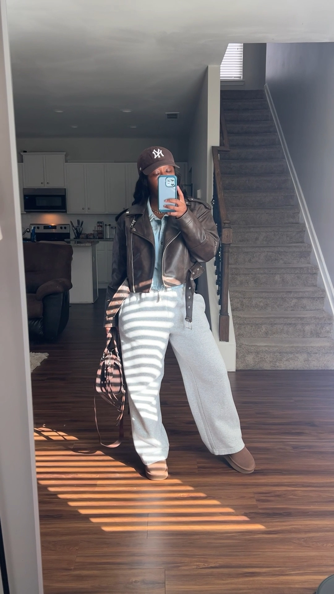 What I wore to my son’s basketball game.

I’m wearing a denim button up shirt, grey wide leg sweatpants, and a brown faux leather jacket.

I styled this casual outfit with a brown NY baseball hat, brown satchel purse, and brown boots.

#LTKOver40 #LTKPetite #LTKootd