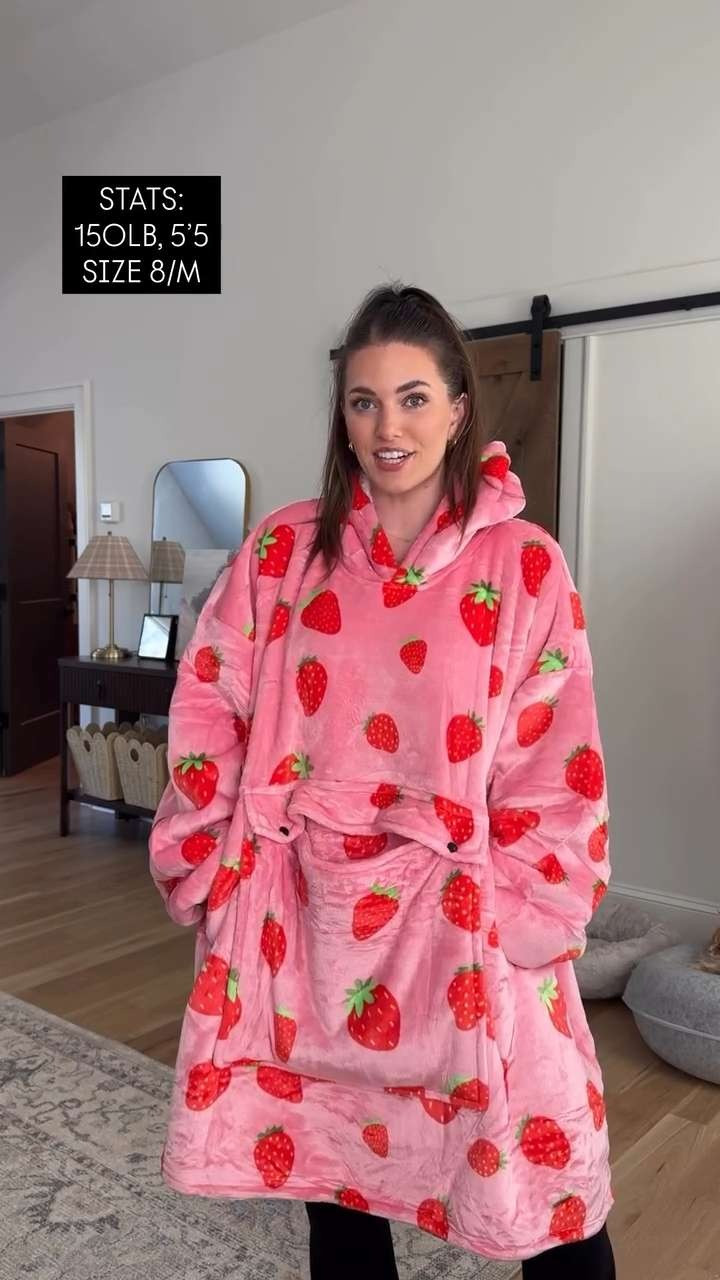 The coziest wearable hoodie blanket!!!! Sooo warm! Huge kangaroo pocket in the front and Sherpa hood. So cute!! And i cannot with the strawberry print!!! One size fits most :) Comes in 55 other prints!! 

 #LTKValentine #LTKgrwm #LTKmorningroutine
