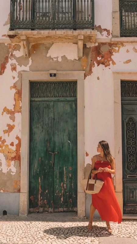 Chic Summer Travel Outfit. 

Sarah Butler of @SarahChristine wears red pleated midi dress with spaghetti straps and plisse detailing in Lisbon, Portugal. 

Summer outfits, summer outfit ideas, casual summer outfits, stylish travel outfits, summer outfits 2023, red dress, pleated midi dress, Portugal travel outfits.

#LTKeurope #LTKSeasonal #LTKtravel