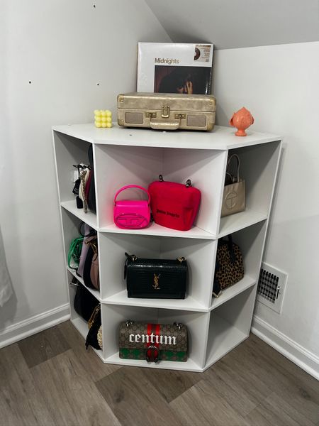 Meech was getting rid of this Target corner bookcase and I used it to store and display my purses 👛

#LTKHome #LTKFindsUnder100 #LTKStyleTip