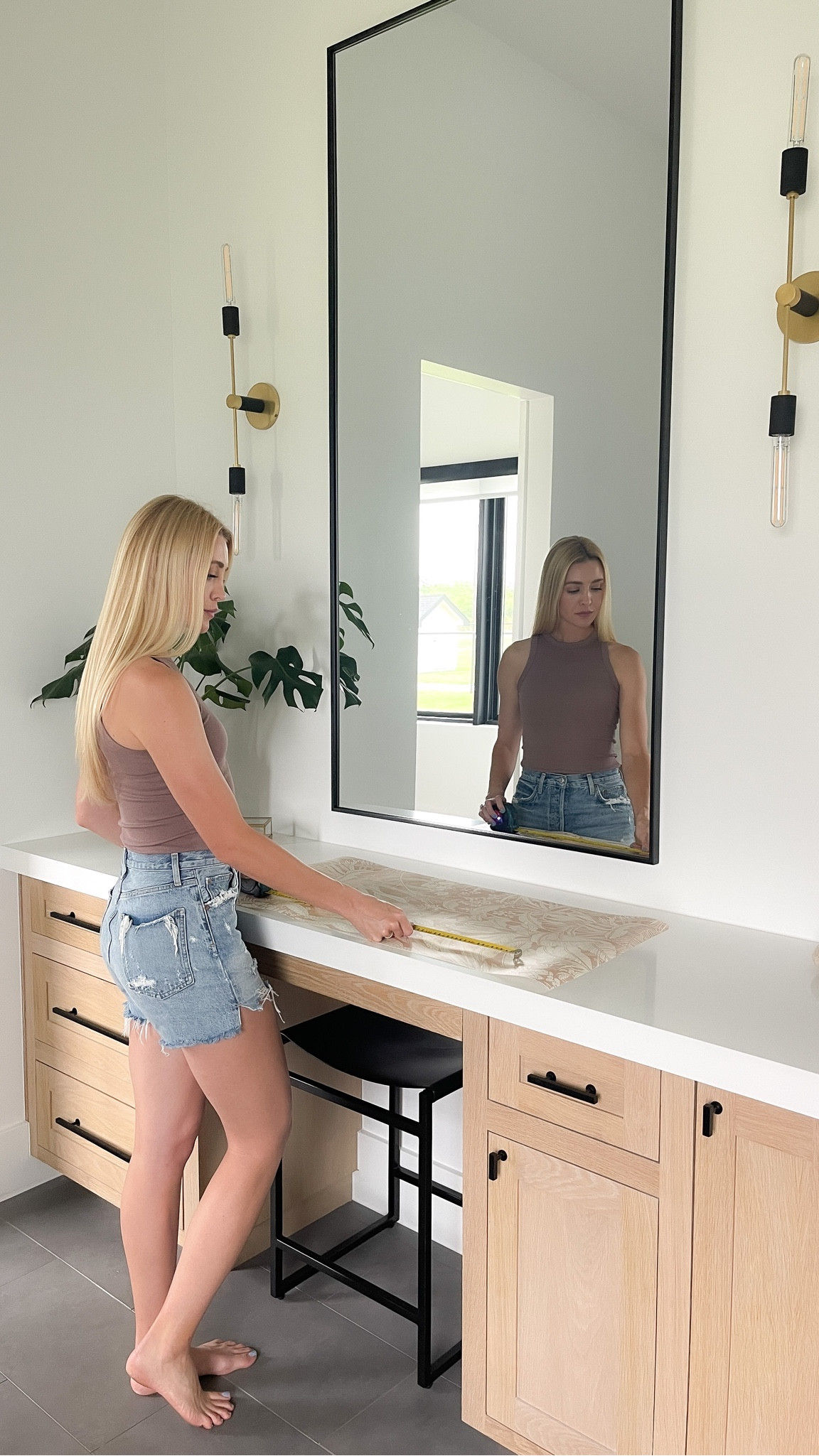 Create the perfect vanity space with a large mirror and sconces.

#LTKhome #LTKsalealert