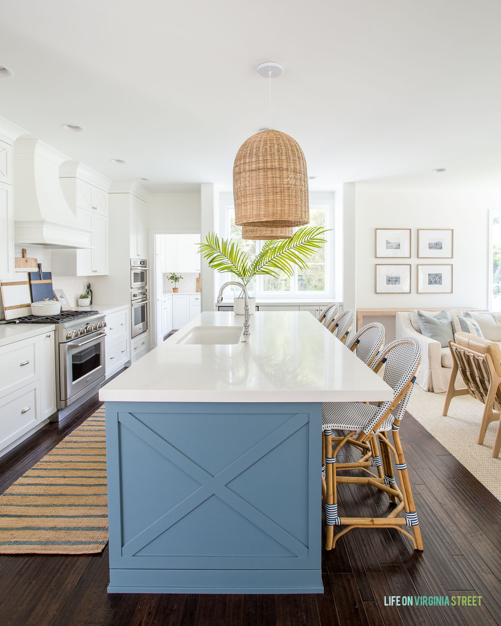 We loved our large size basket pendant lights in our Omaha pool house kitchen! Our white backless counter stools, striped blue runner rug, blue ceramic vase, gold star sconce lights and other kitchen favorites complete the look . Also linking our swiveled armchairs and indoor/outdoor sofa.

#LTKdayinmylife #LTKHome