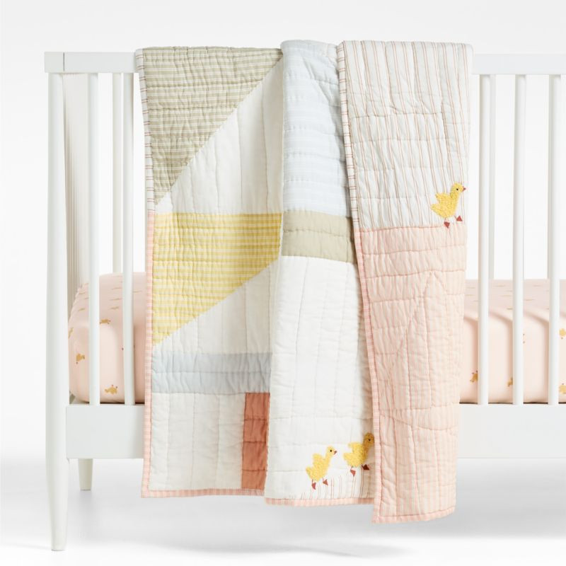 Pata Sunwashed Patchwork Organic Cotton Reversible Baby Crib Quilt | Crate & Kids | Crate & Barrel