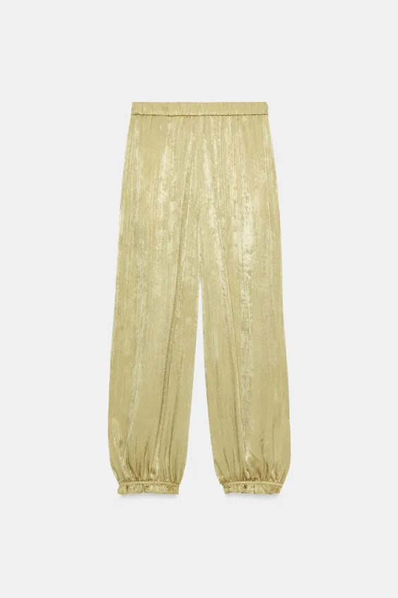 Model height: 183 cmMid-waist trousers with an elastic waistband. Front pockets and balloon legs ... | Zara UK