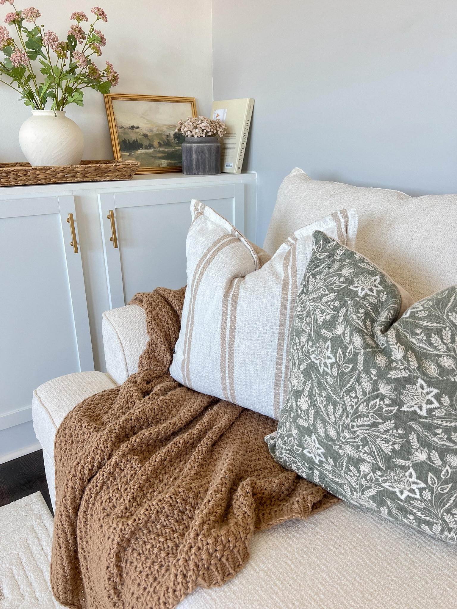 Earthy, organic, nature inspired... 
Loving this combination of stripes and florals both perfect patterns for spring. 🌿🤎Spring decorating my living room
.
.
..
.
#springdecorating
#springdecor

#LTKSeasonal #LTKhome #LTKSpringSale