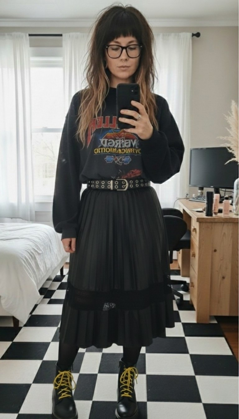 Mixing textures today with this pleated midi skirt and an oversized graphic sweatshirt. I love how the grommet belt cinches the waist to keep the silhouette polished while the yellow laces on these combat boots add just the right amount of "pop." This is my go-to for a cool-but-comfortable day in the city.

#LTKootd #LTKMidsize #LTKSeasonal