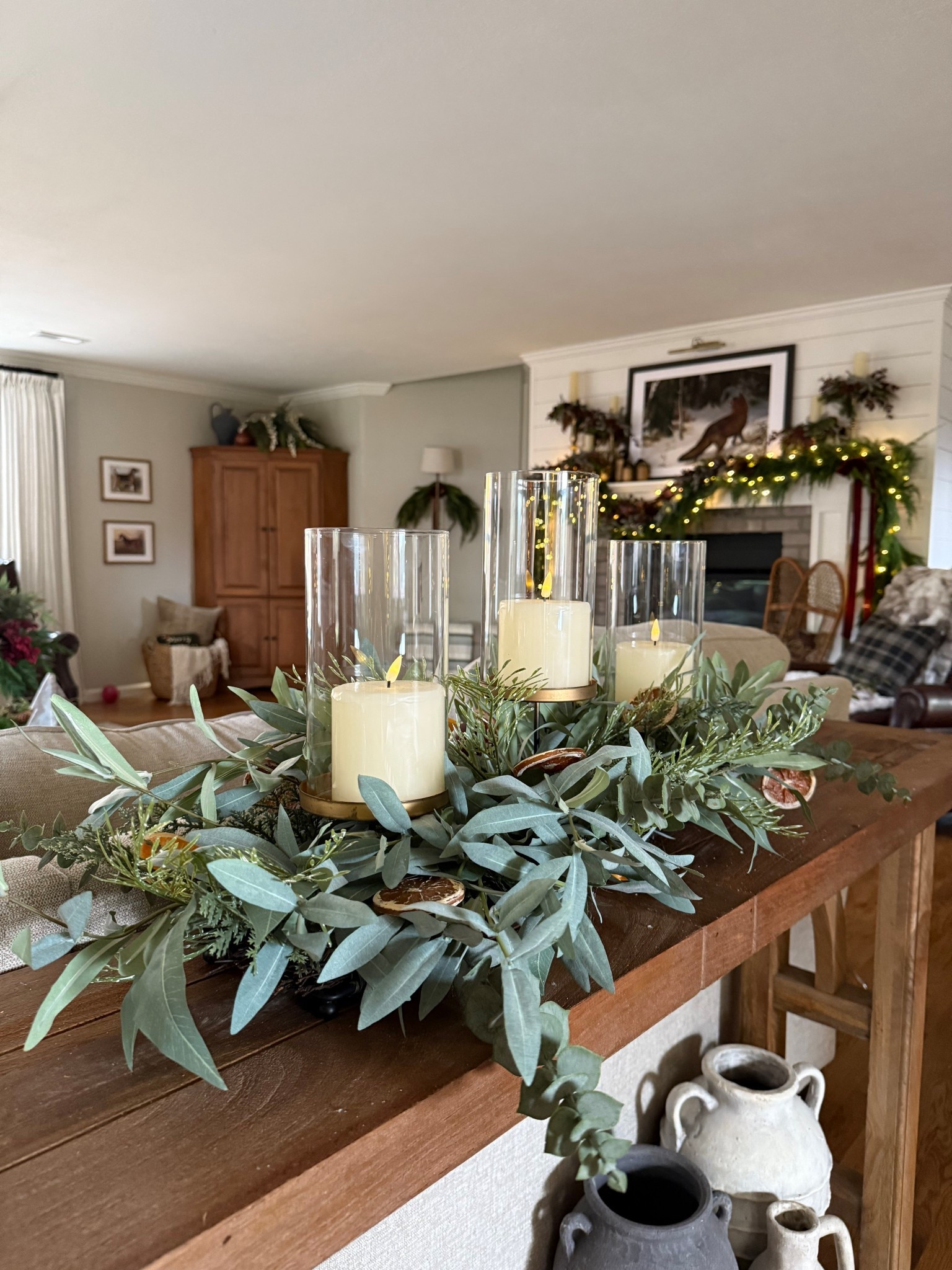 Easy Centerpiece with beautiful eucalyptus and citrus touches. I love the hurricane candle look. 

#LTKHome #LTKSeasonal #LTKHoliday