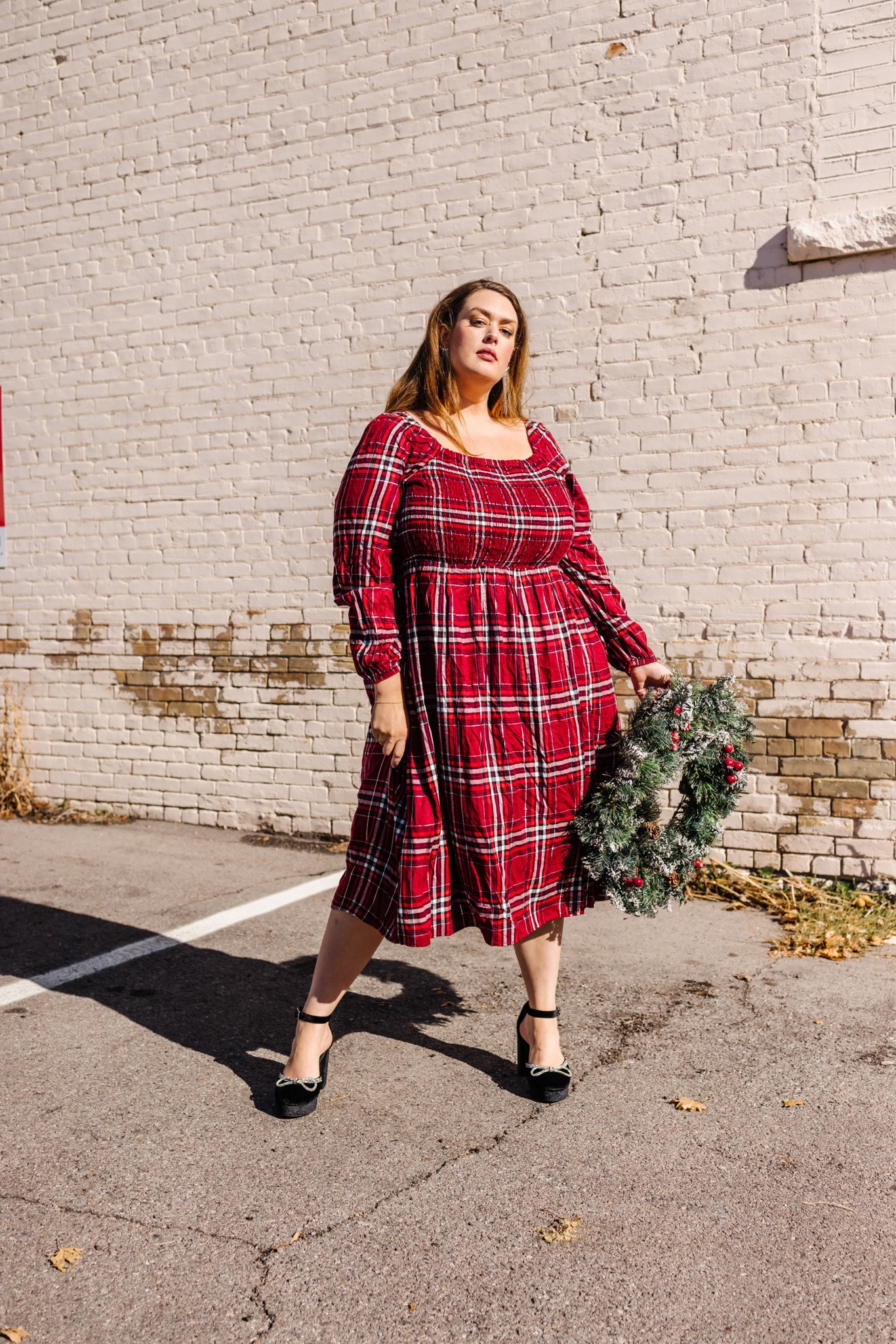 Plus size holiday dress. Red and black plaid. MIDI dress length with sparkles. Sparkly bow platform heels. 

#LTKcurves #LTKHoliday #LTKSeasonal