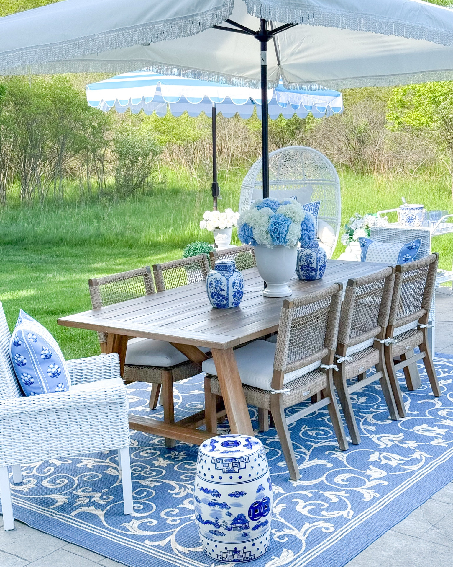Shop my outdoor entertaining space! Use my code LAURAPICKS for a discount on my pillow covers 🩵

Outdoor table, outdoor furniture, egg chair, teak table, teak chairs, chinoiserie, blue and white decor, blue outdoor rug, garden stool, faux hydrangeas, Amazon finds, outdoor pillows, pillow covers, rattan bar cart, Walmart finds, affordable home decor, white planters, umbrellas, patio decor, traditional home

#LTKHome #LTKSeasonal #LTKSaleAlert