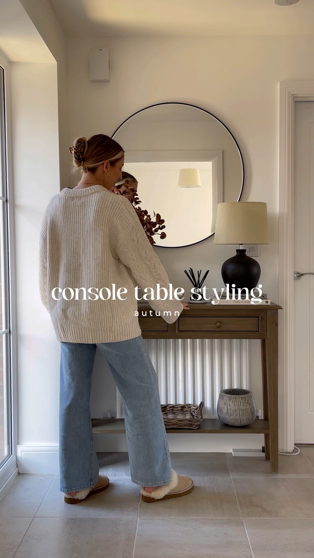 Autumn console table styling 🍂🤎  

Console table, lamp, circle mirror, home interiors, cable knit jumper, blue jeans, Ugg slippers, faux flowers, stone vase, Jo malone diffuser 

#LTKSeasonal #LTKstyletip #LTKhome