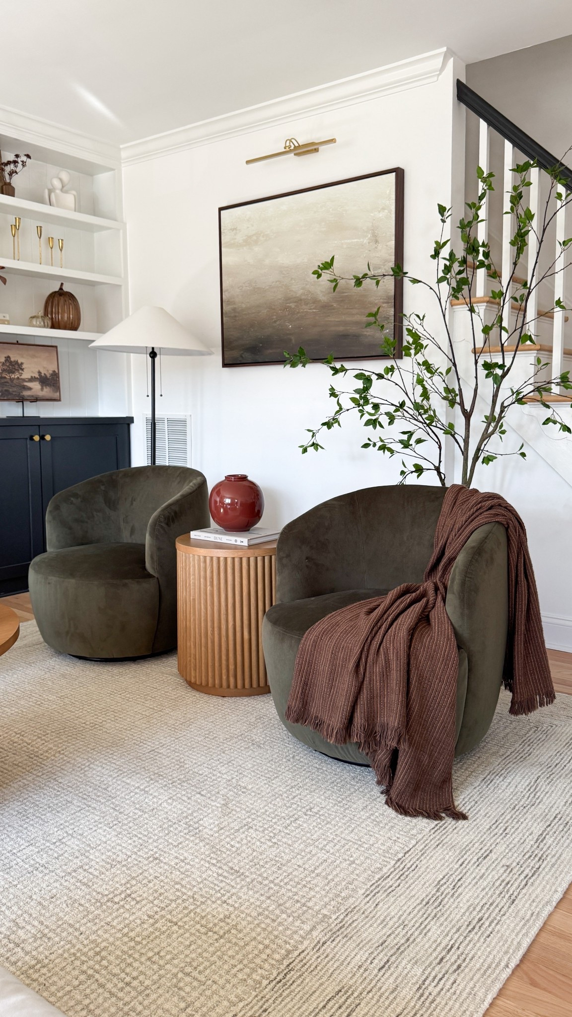 Still swooning over this little corner ✨ These swivel chairs completely transformed the space — so plush, modern, and the perfect cozy spot for morning coffee or evening chats. Paired them with this fluted side table (one of my fave affordable finds!) and layered in rich fall tones to make it feel warm + inviting. 🍂

Tap to shop the chairs, table, and more of my cozy fall home finds 🤍

#LTKHome #LTKFinds #LivingRoomDecor #CozyHome #ModernOrganicStyle


#LTKSeasonal #LTKHome #LTKSaleAlert