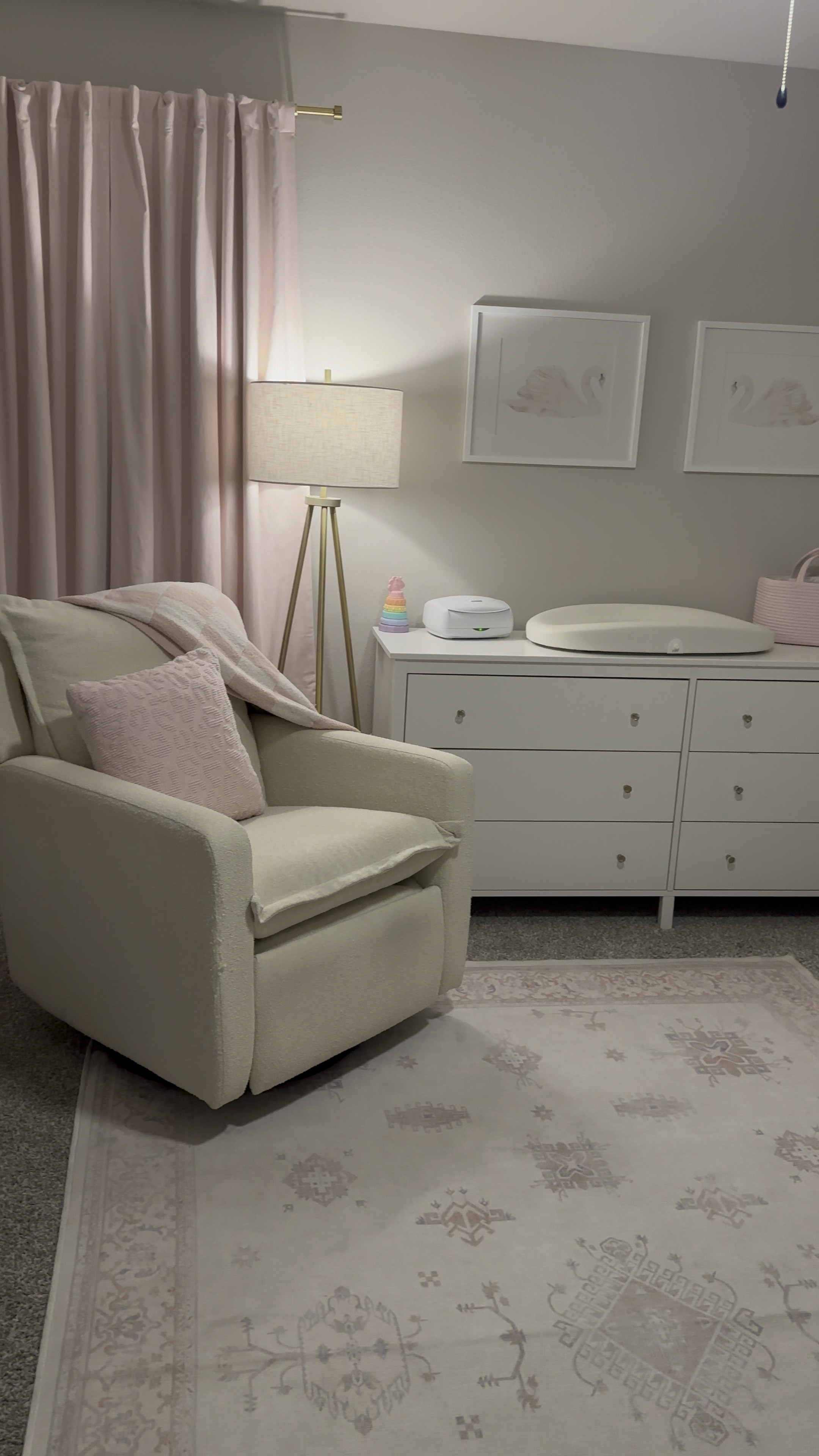 Baby girl nursery Inspo #acryliccrib #crib #pinkrug #nurseryrocker #nurseryrug #bookshelf #pinkcurtains #nurserycurtains #babygirlroom #nurserywalldecor #swandecor #dresserknobs #pinksheets #floorlamp #nurserylamp #babypinknursery #pinkdecor #curtainrod 