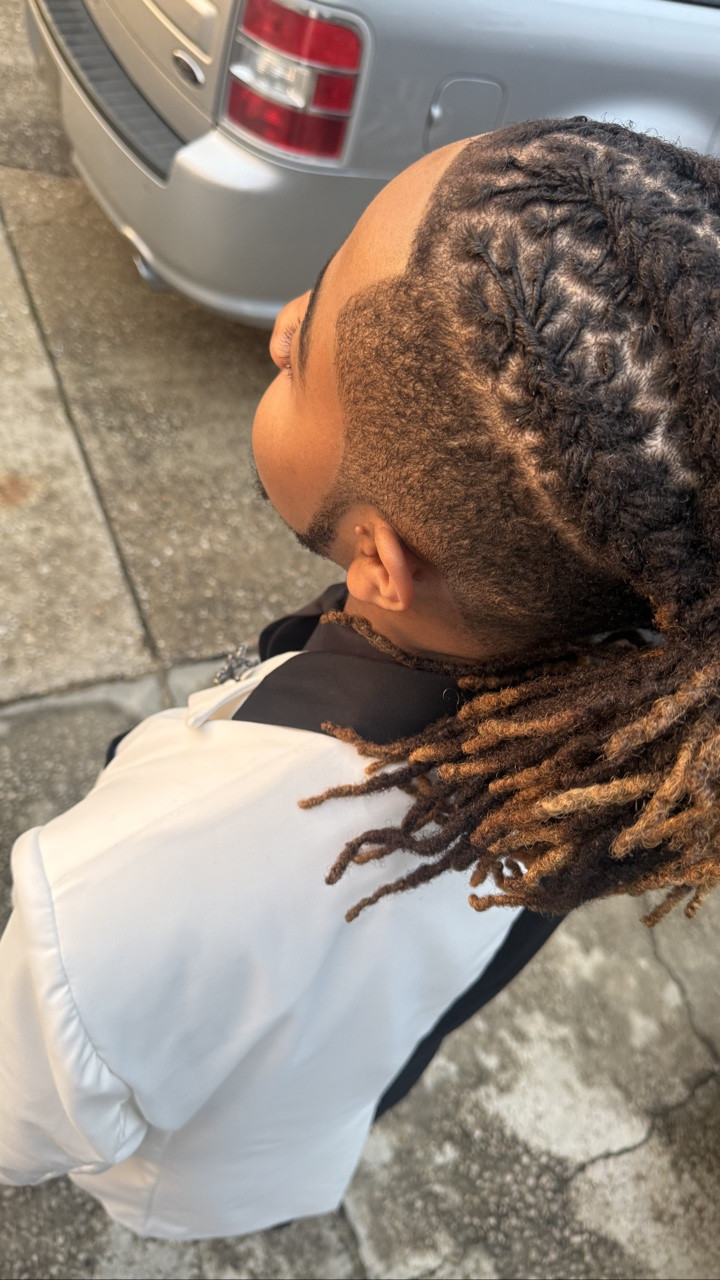 Prom season kinda snuck up on me 🤦🏾‍♀️ Tyler’s locs were in serious need of a retwist for a while. Like a good while, but I kept putting it off because retwisting locs is no joke on my fingers and I was holding off to see if Rich would pay somebody else to do it 🤣🤣. But prom was coming and I needed my Boog to be absolutely fresh when he walked out that door so I finally sat down and got to work. No more procrastinating. Prom said it was time. 😂
And this time I added something new to my lineup.
@baskandlatherco edge control alongside my trusted Shine n Jam. Y’all‼️The combination of these two products had his roots defined, shiny, and smooth…just the way I like them. 🥰 What I love most about Bask and Lather is how it makes the hair actually feel. It brings out the curl pattern, keeps the locs manageable, and there was zero white residue💯 My fingers were already putting in work, and the last thing I needed was product fighting me too.
DISCLAIMER: I am not getting paid for this review. I probably should be though so feel free to blast them up in the comments and let them know. 😂
Tyler was pleased and I was very proud of my work. Bask and Lather plus Shine N Jam. That is the combo. Write it down. 🖤
#locsformen #retwistlocs #promseason